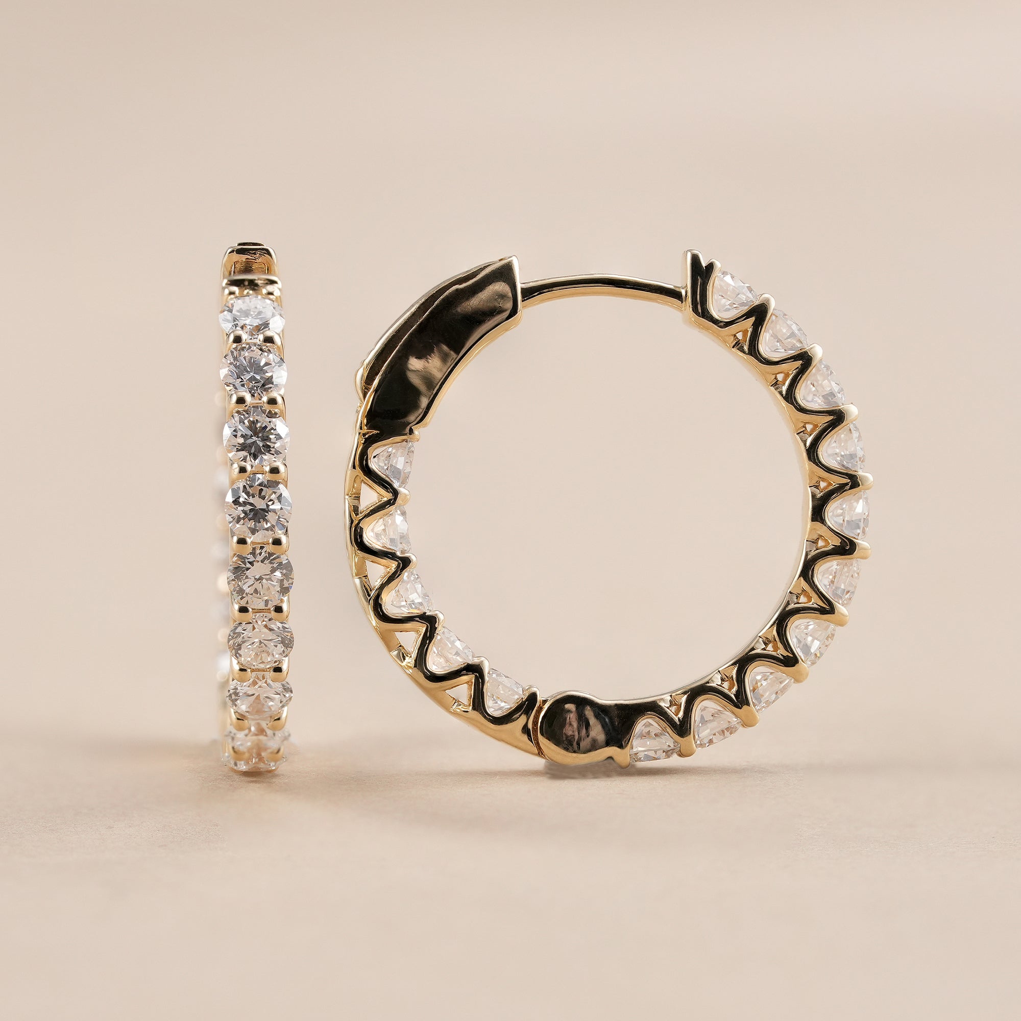 Round brilliant lab diamond hoop earrings with polished gold huggie design