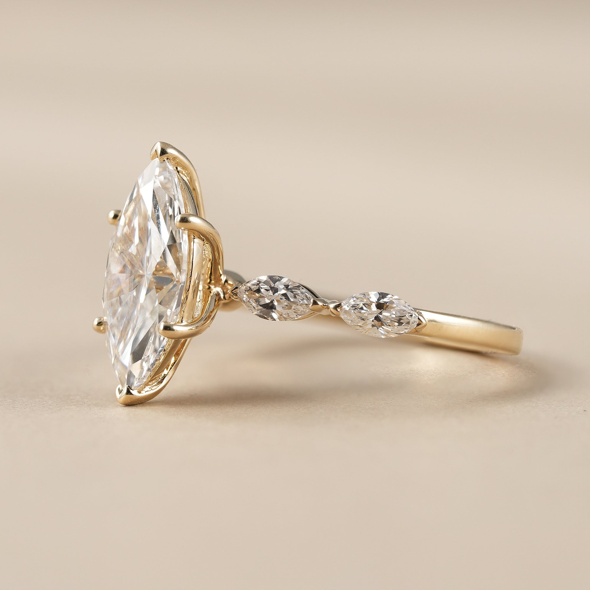Marquise Cut Diamond Engagement Ring With Marquise Accents Band