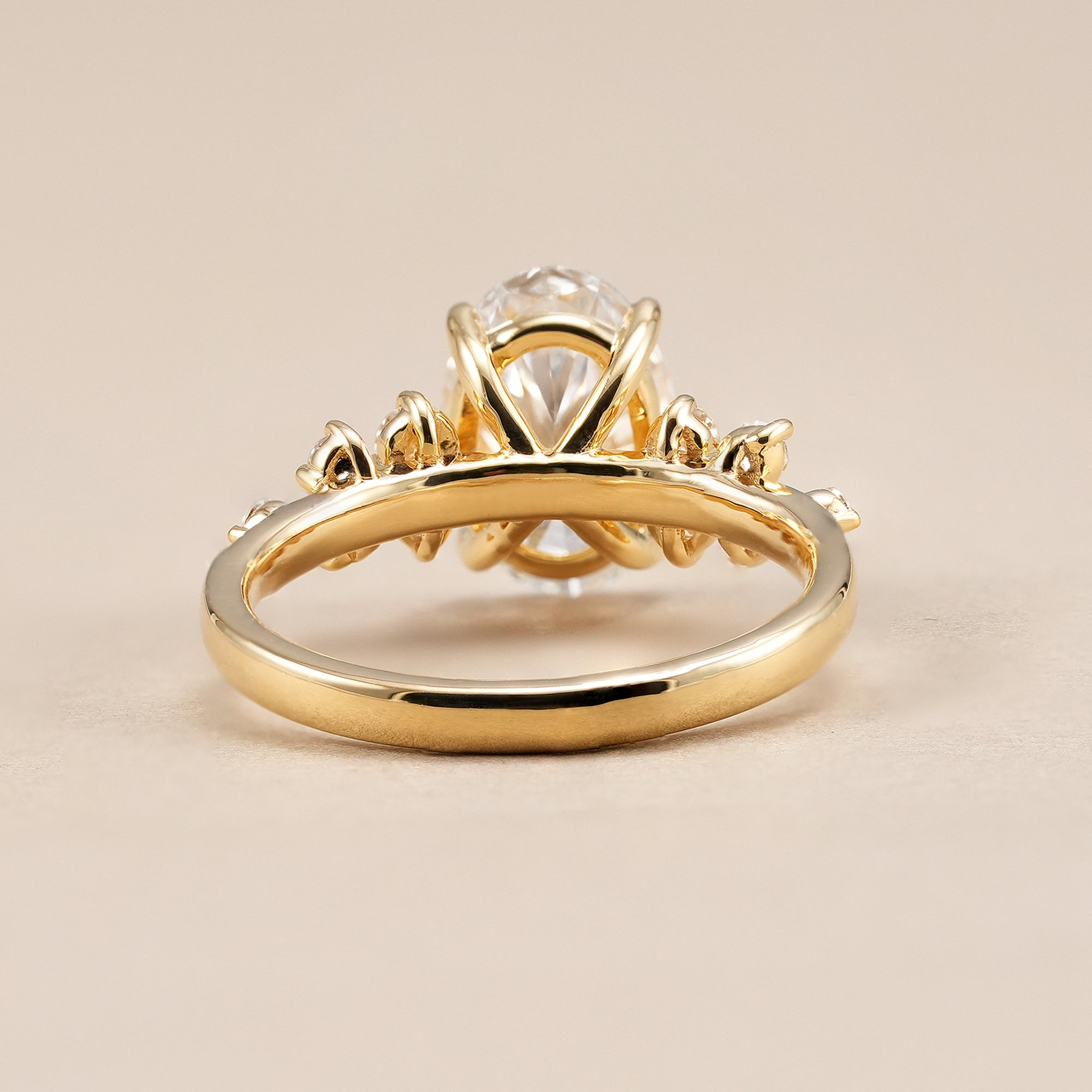 Oval lab diamond ring with delicate flower inspired side stones