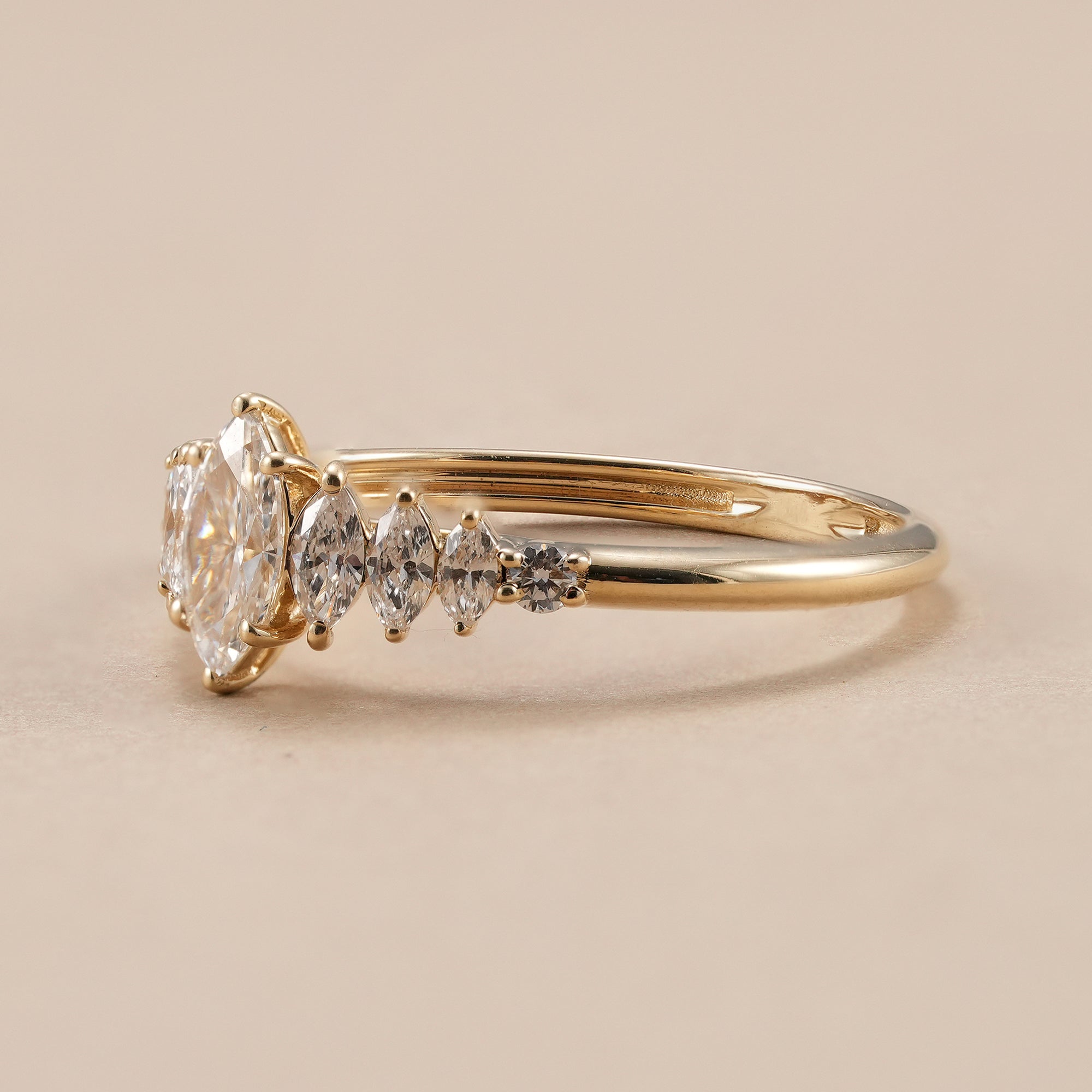 Elegant marquise diamond engagement ring in yellow gold.