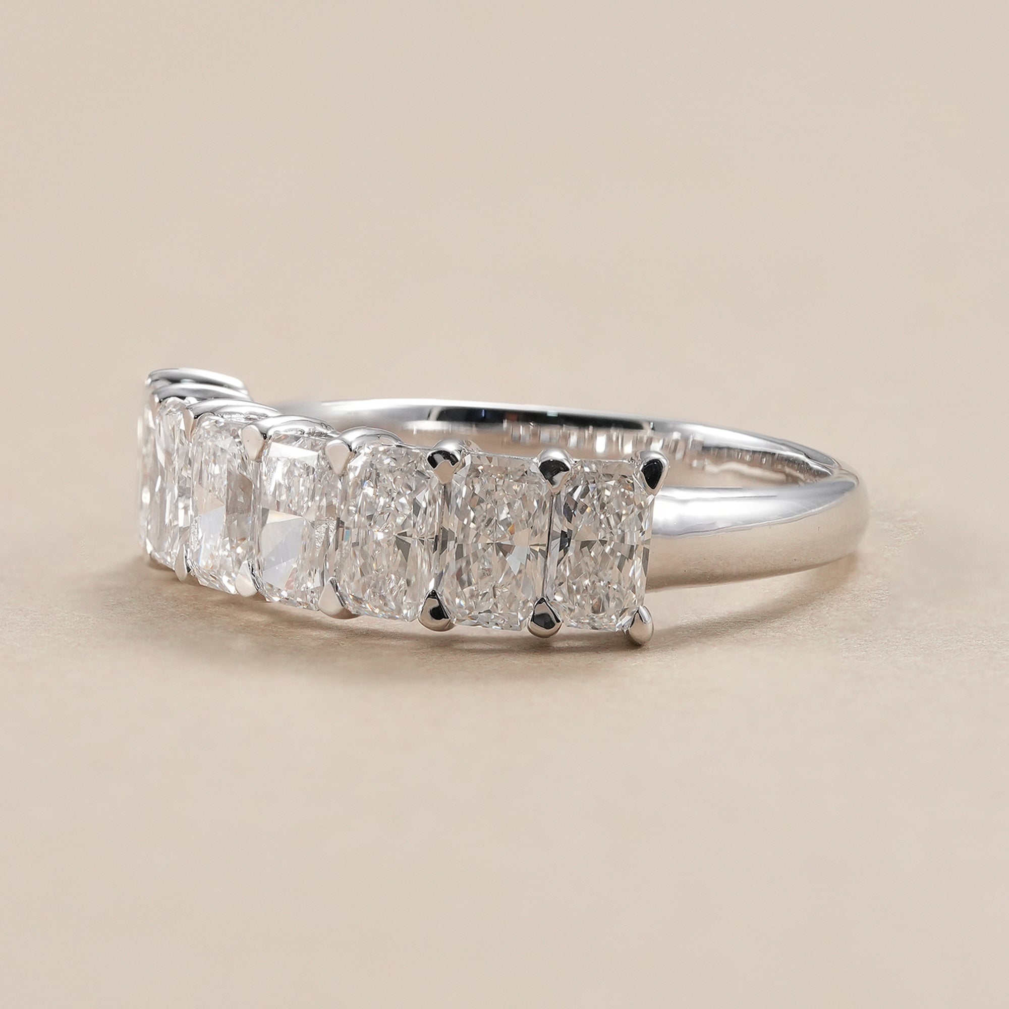 Seven stone radiant lab diamond wedding ring handcrafted in white gold.