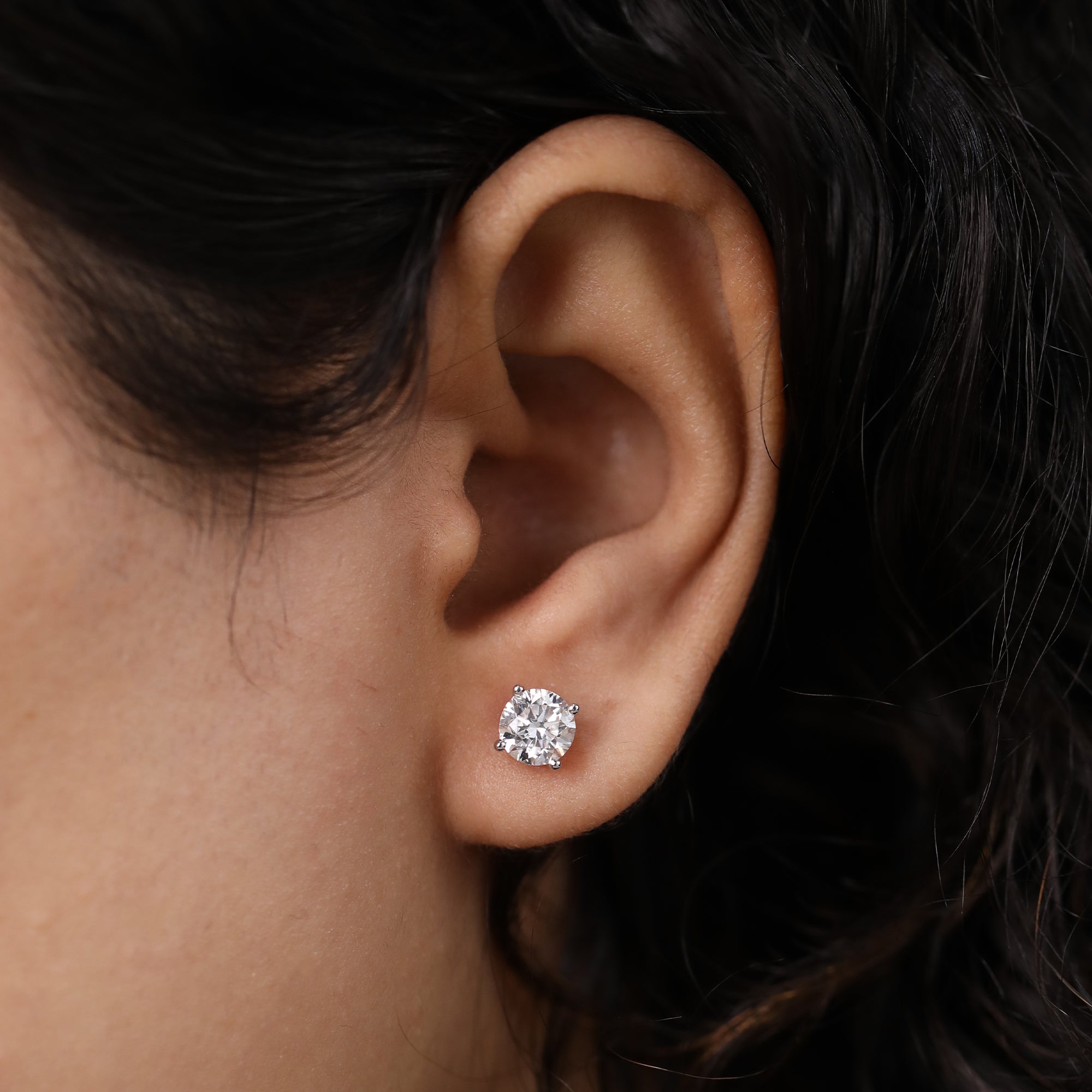 Timeless round diamond studs for anniversary surprises or meaningful birthday gifting