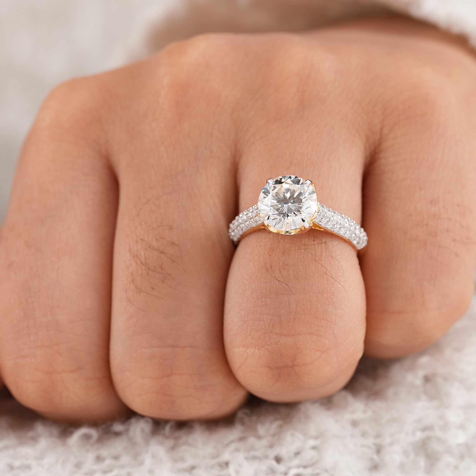 Elegant round diamond solitaire ring with pavé side band
