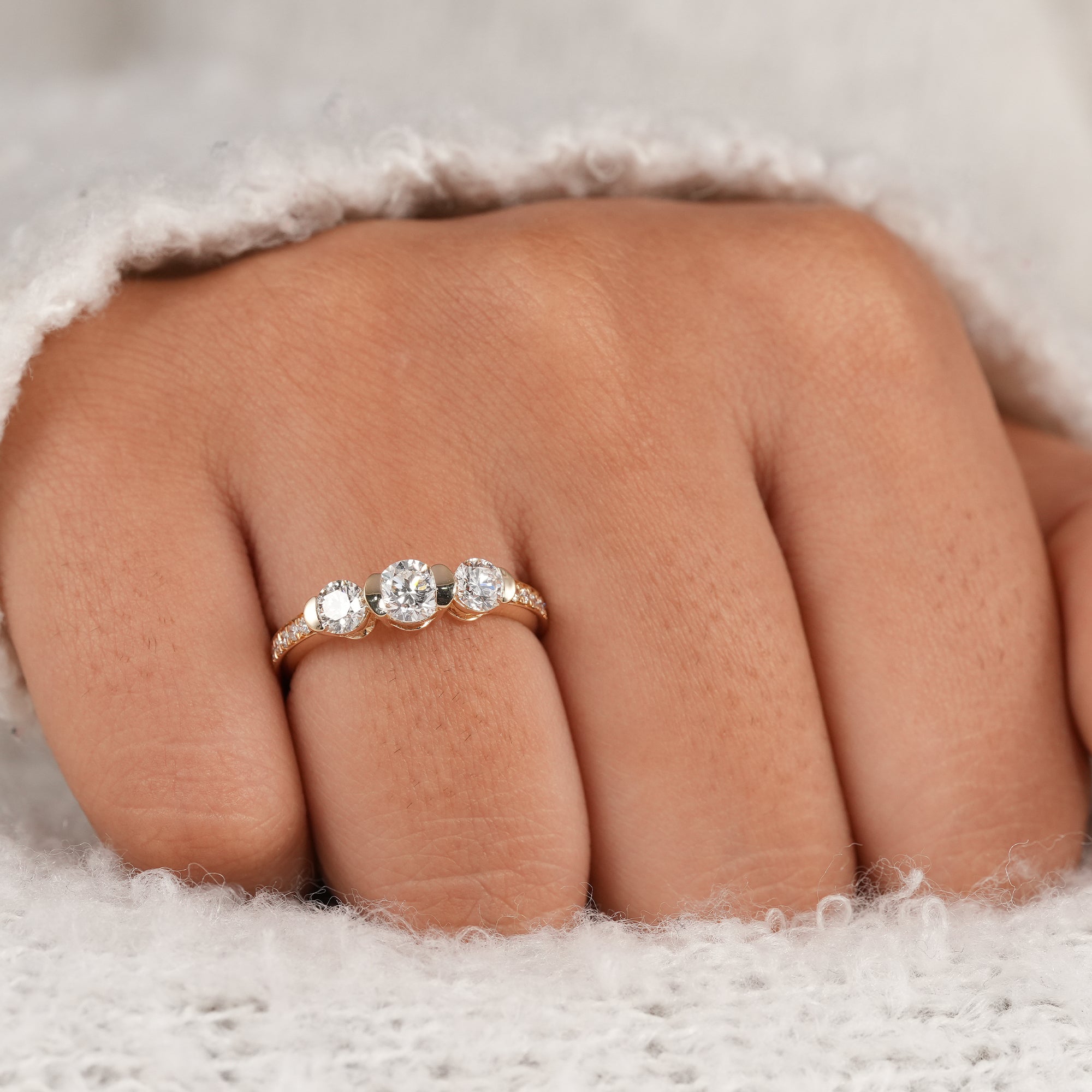 Fine jewelry three stone diamond ring with polished yellow gold band