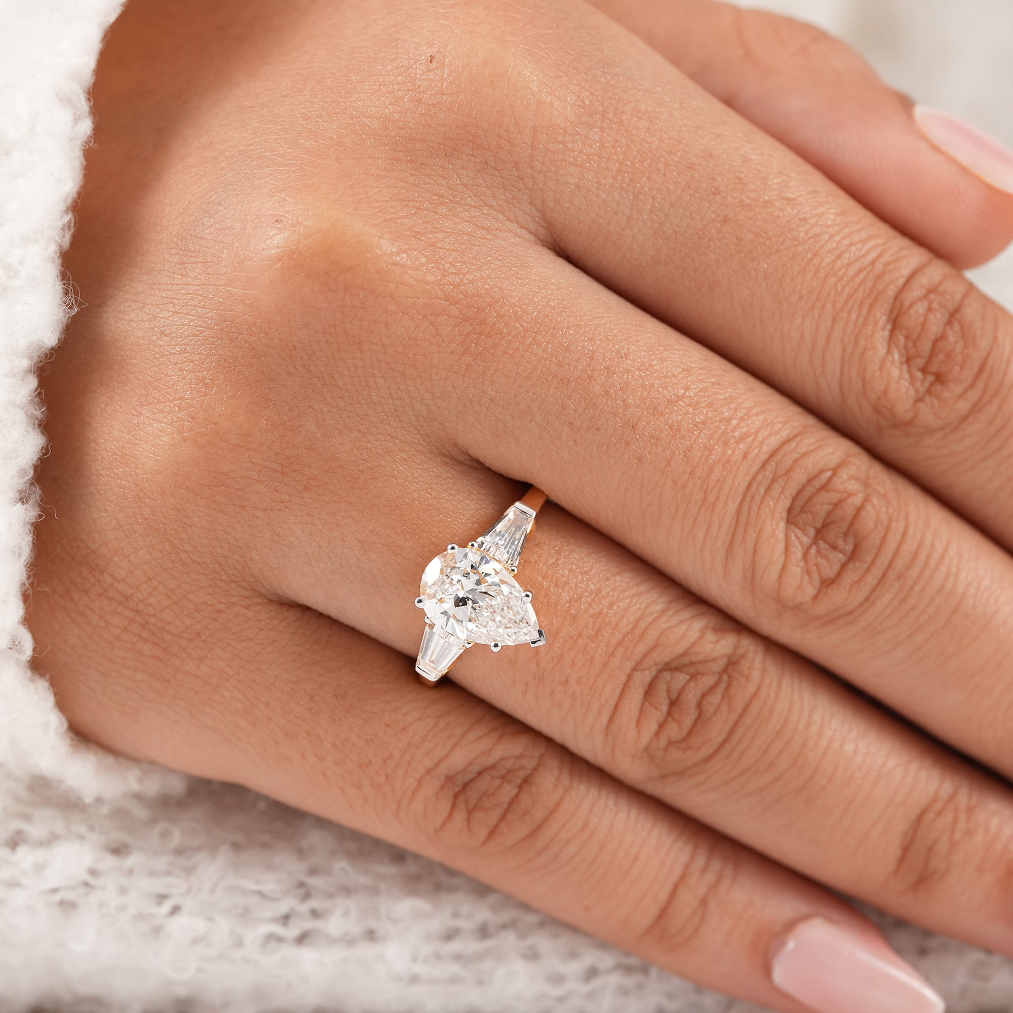 Pear trilogy engagement ring symbolizing past present and future