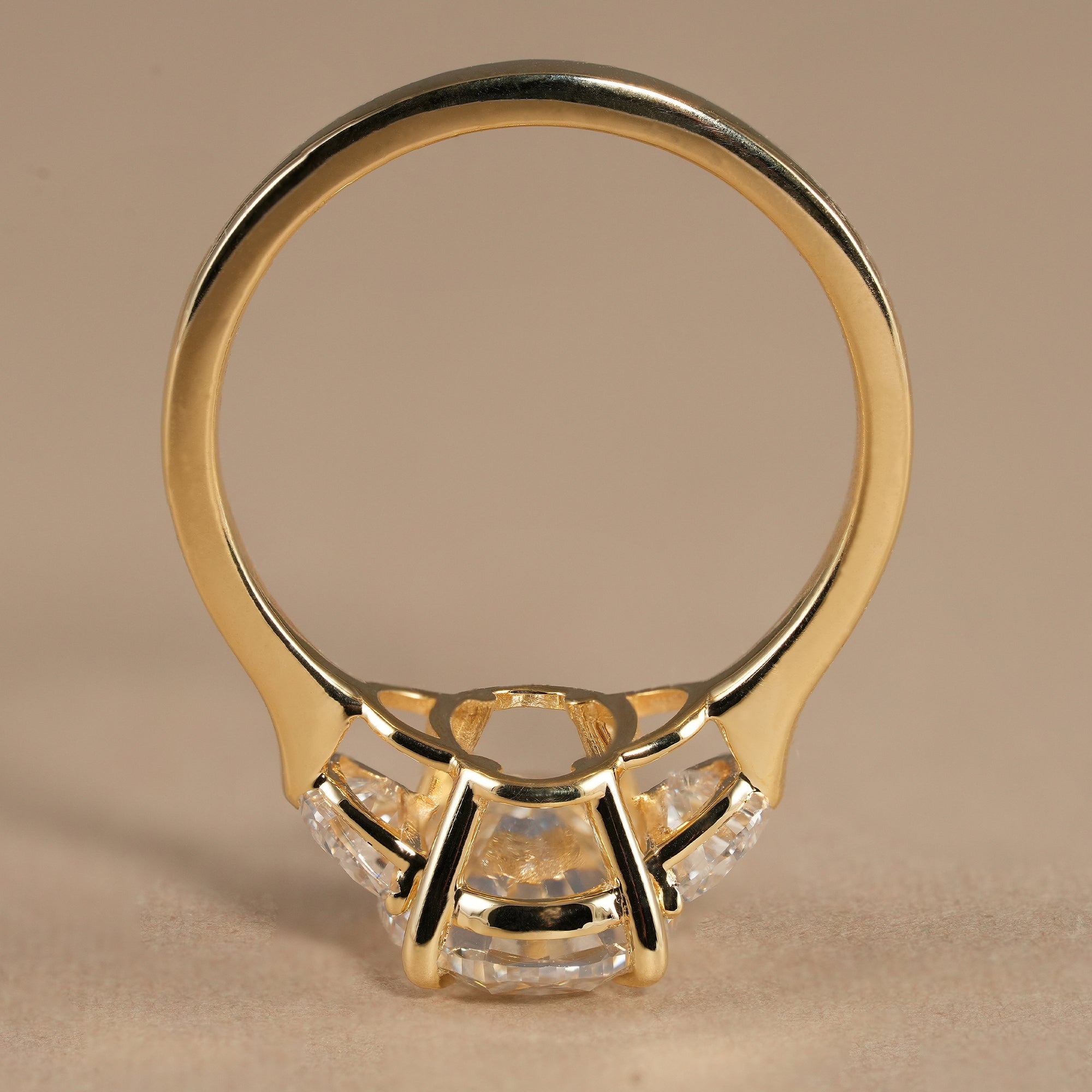 Oval proposal ring featuring brilliant center diamond and half moon accents