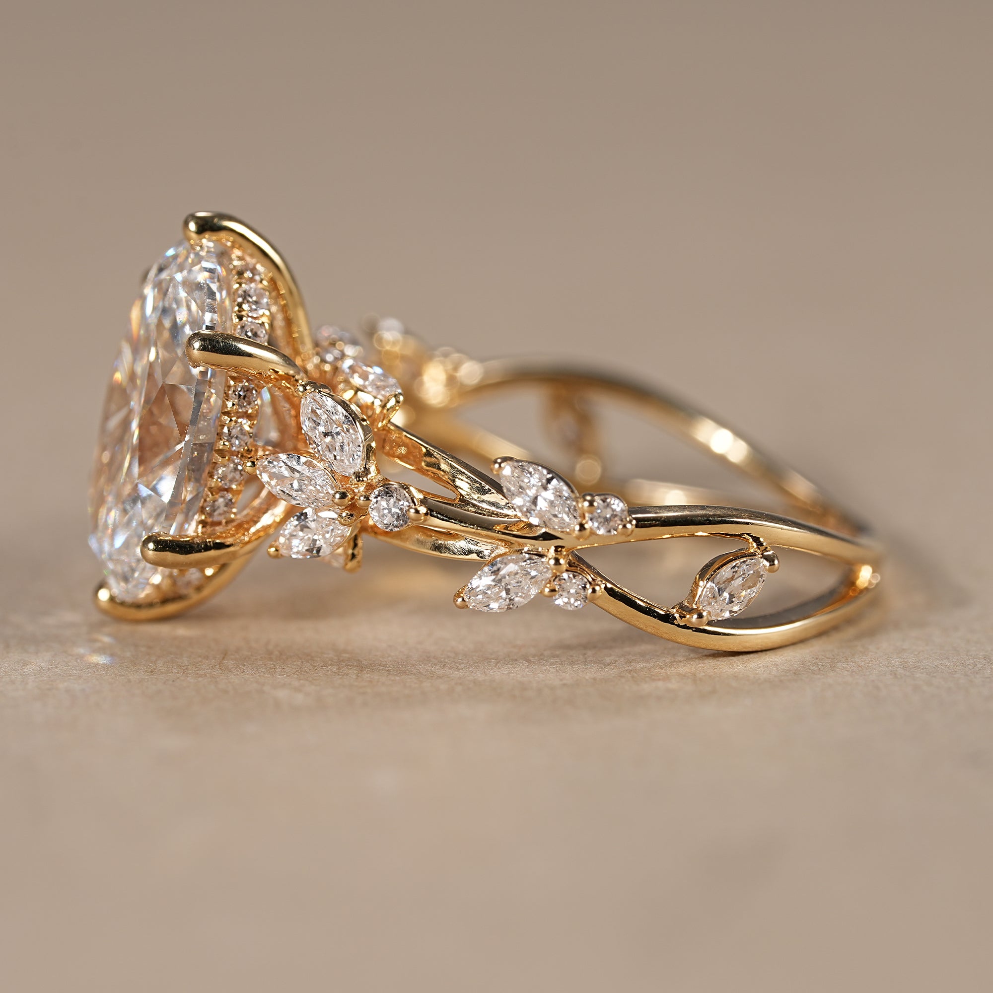 Vintage inspired oval lab grown diamond ring with nature inspired leaf band design
