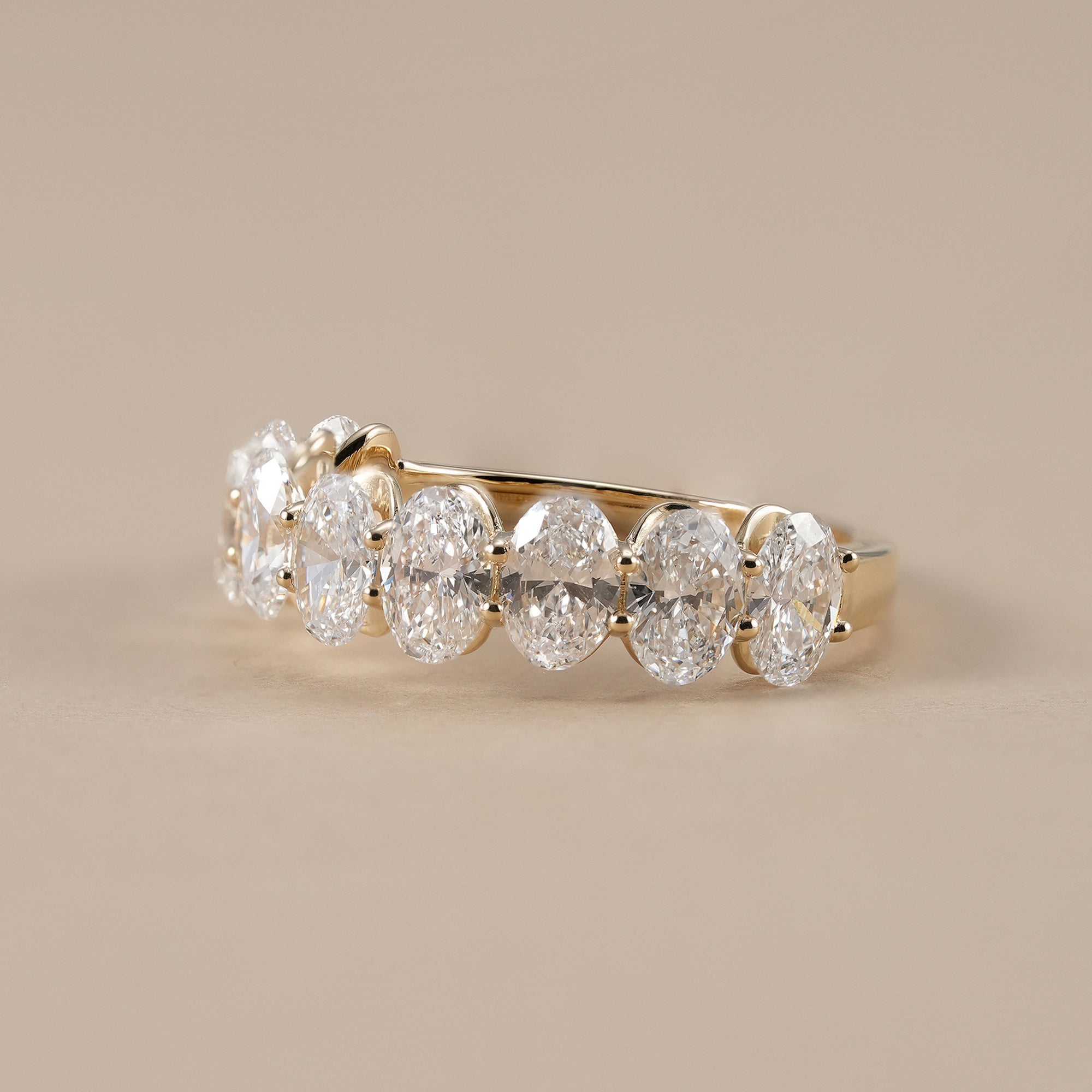 Nine stone oval diamond wedding band for women