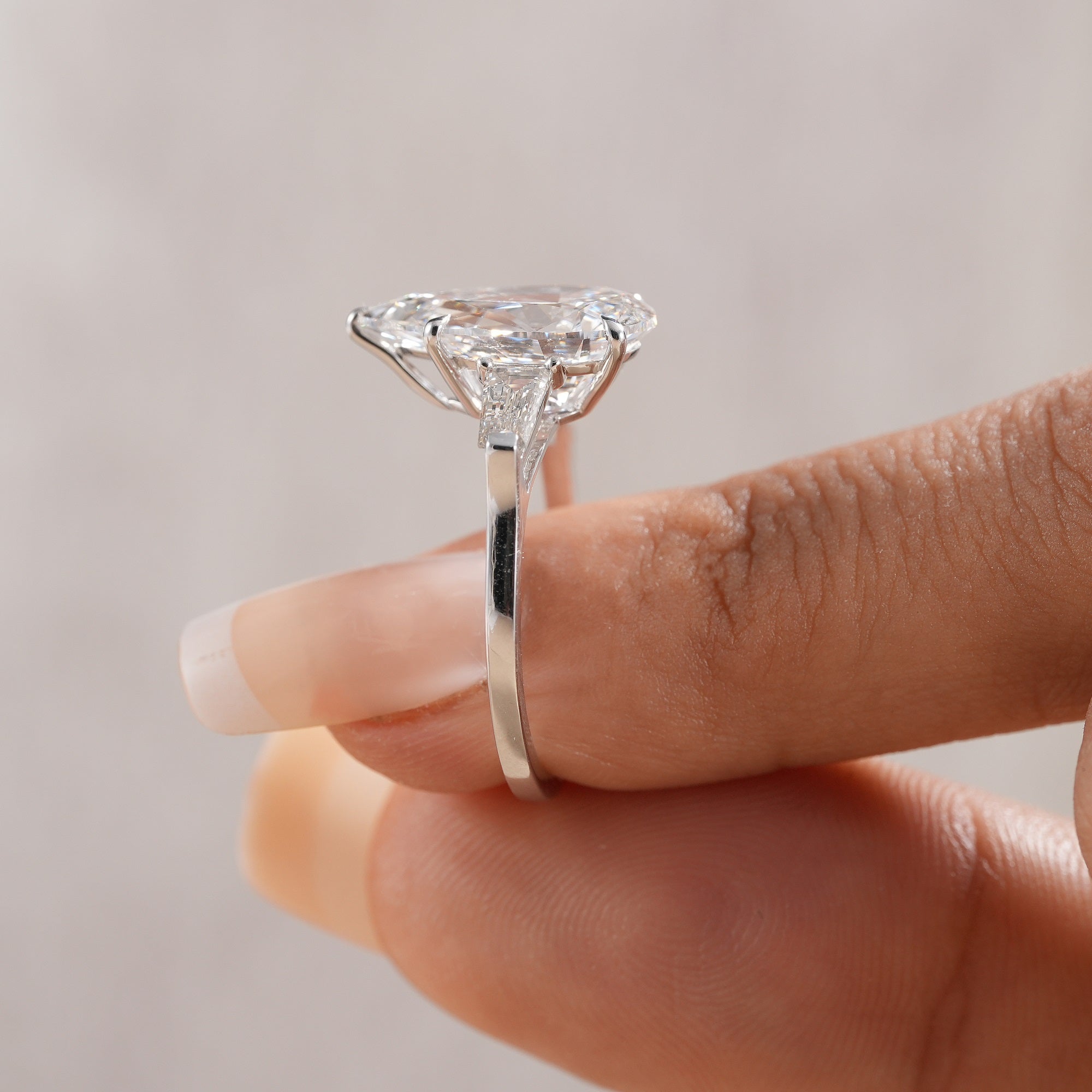 Pear lab grown diamond ring with geometric baguette side stones