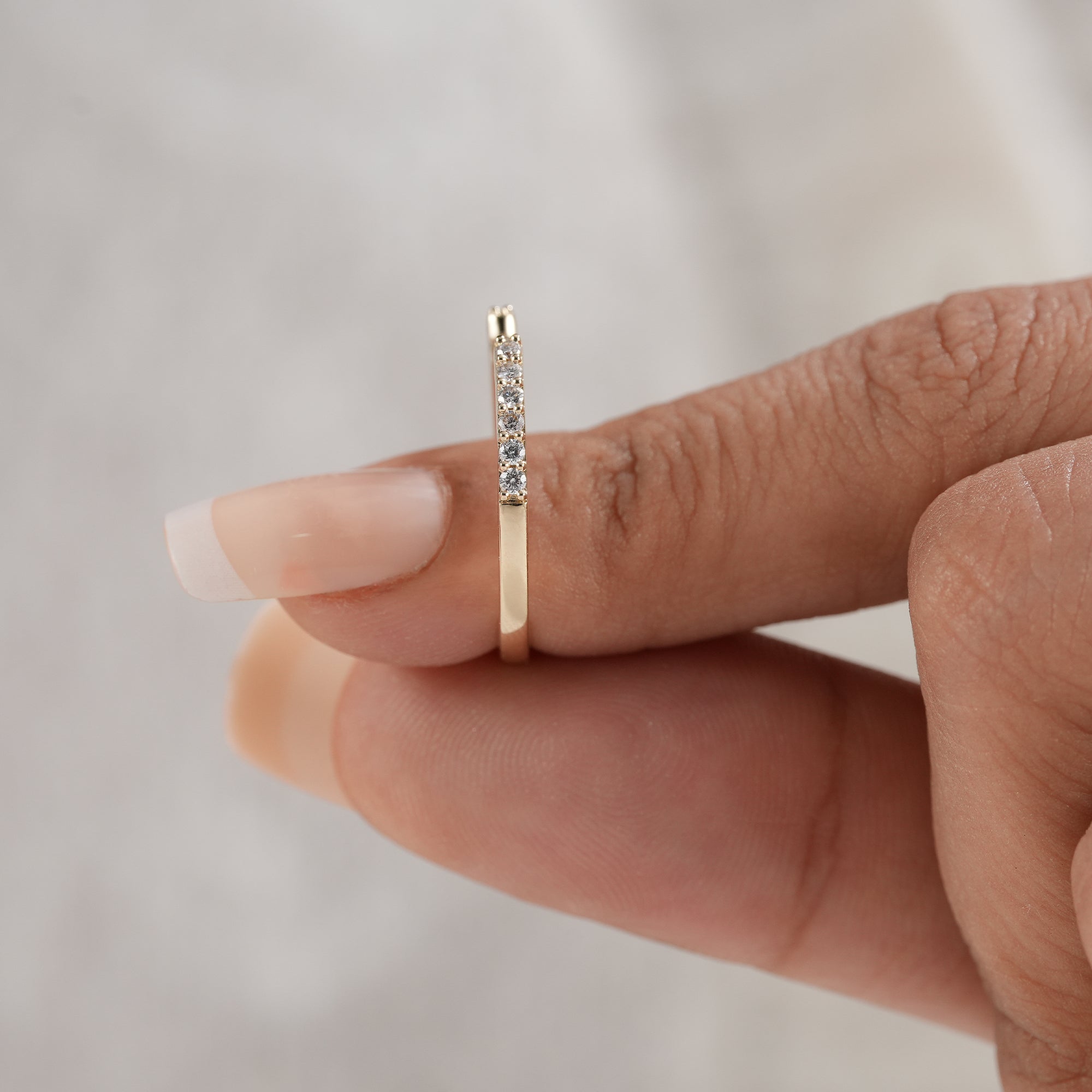 Delicate open wedding ring with lab grown diamonds
