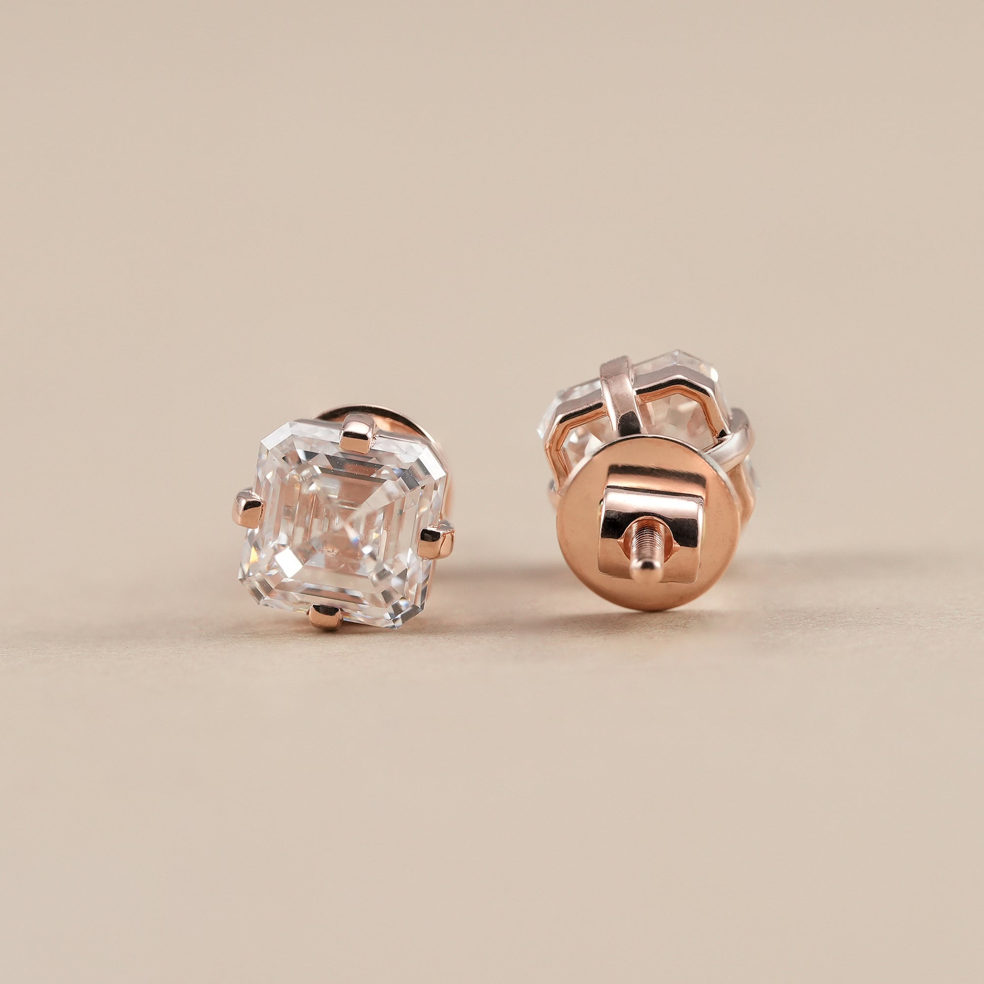 Premium IGI certified solitaire lab diamond earrings with brilliant Asscher cut diamonds.
