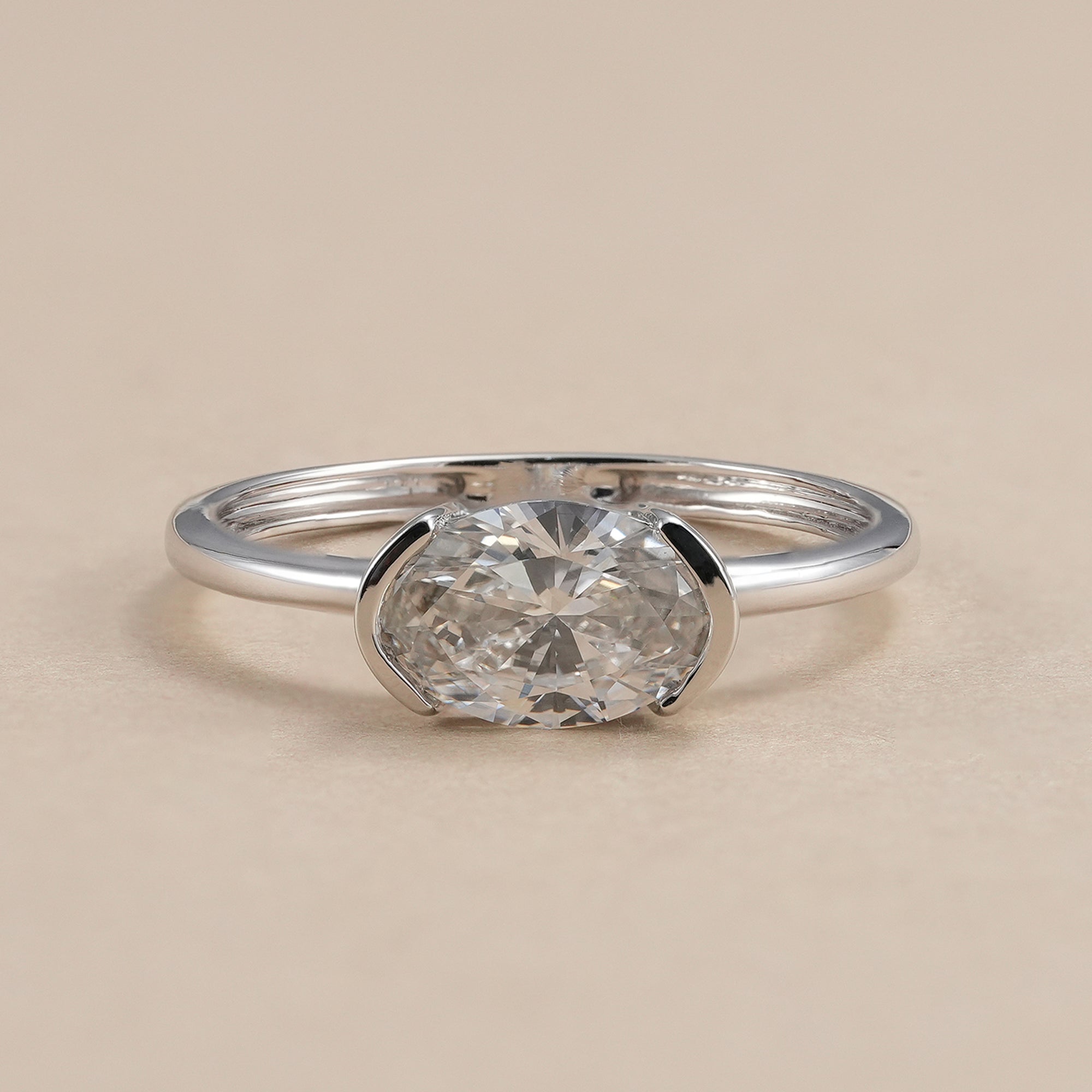 Oval diamond solitaire ring with half bezel lab grown diamond