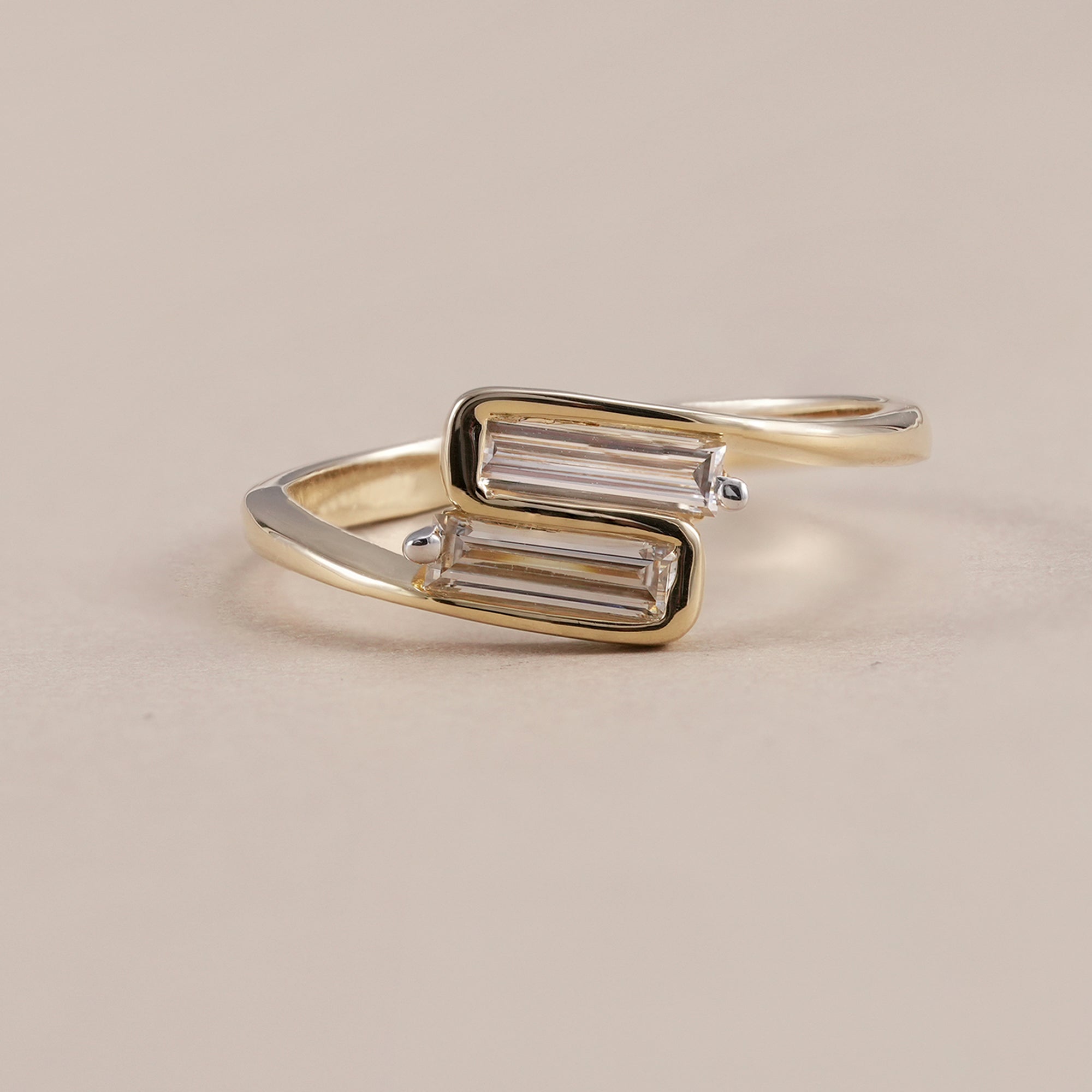 Baguette lab diamond Toi et Moi ring in yellow gold bezel setting