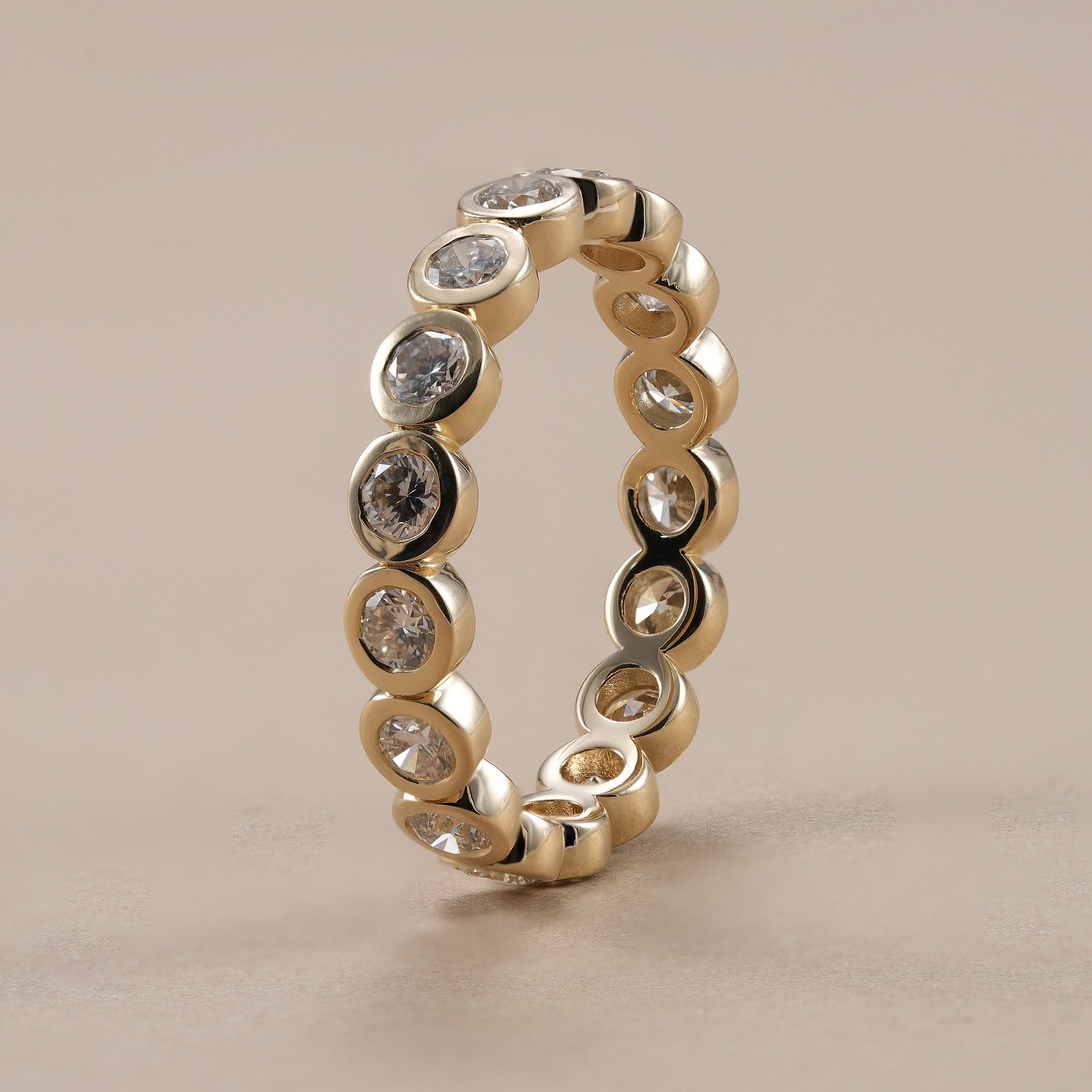 Minimalist bezel set stackable diamond ring for women.