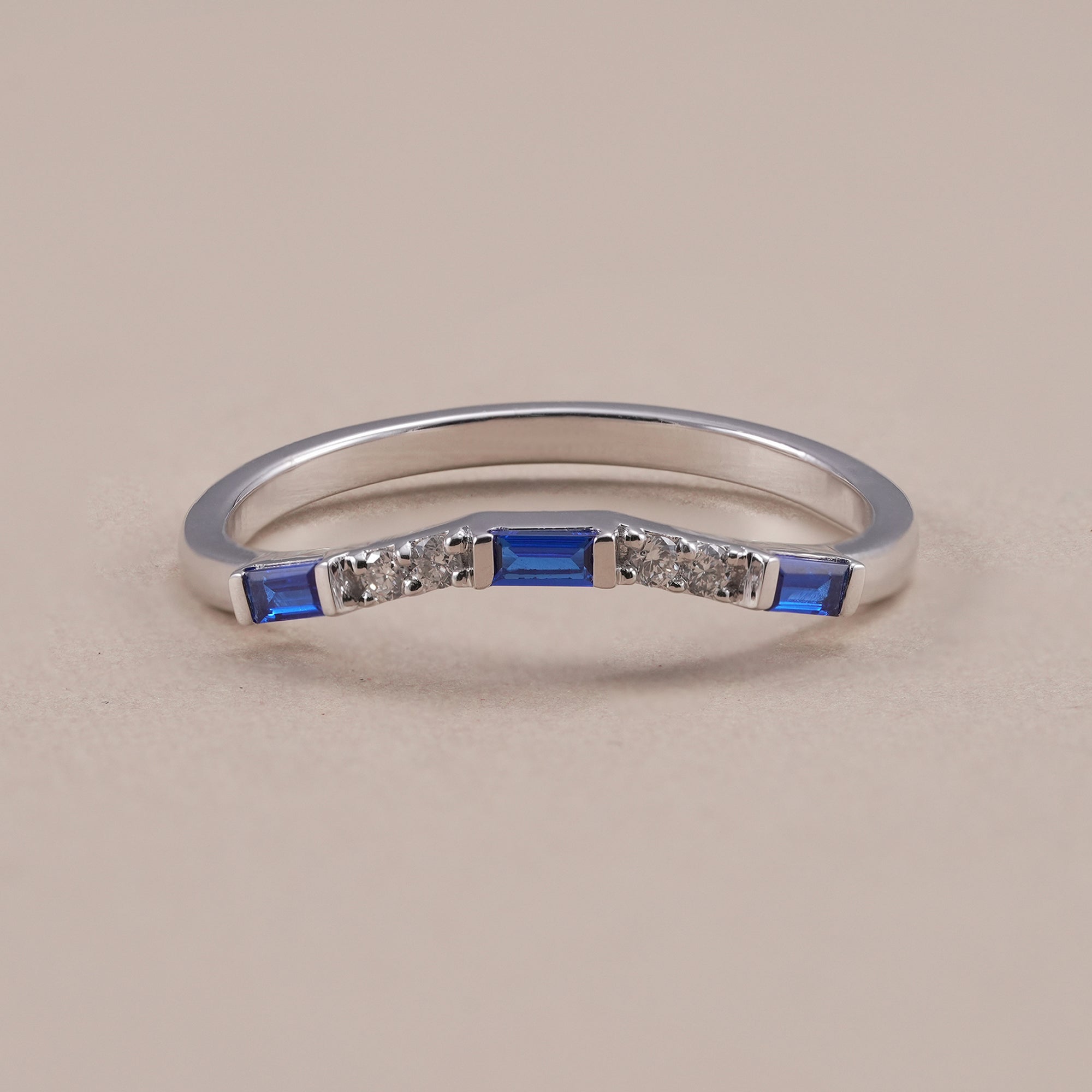 Blue baguette diamond curved wedding band with round lab grown diamonds