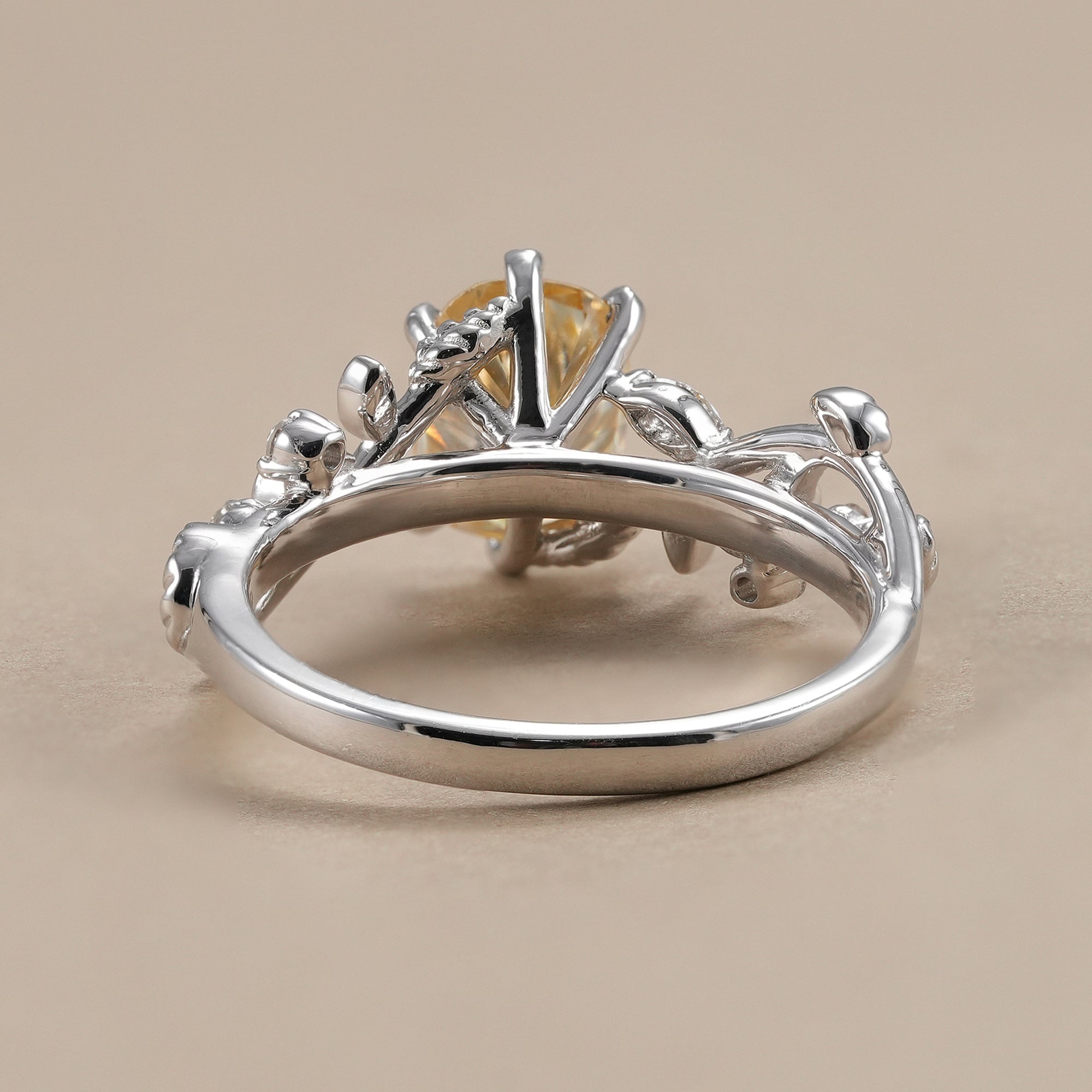 Leaf inspired diamond ring with marquise accent stones.