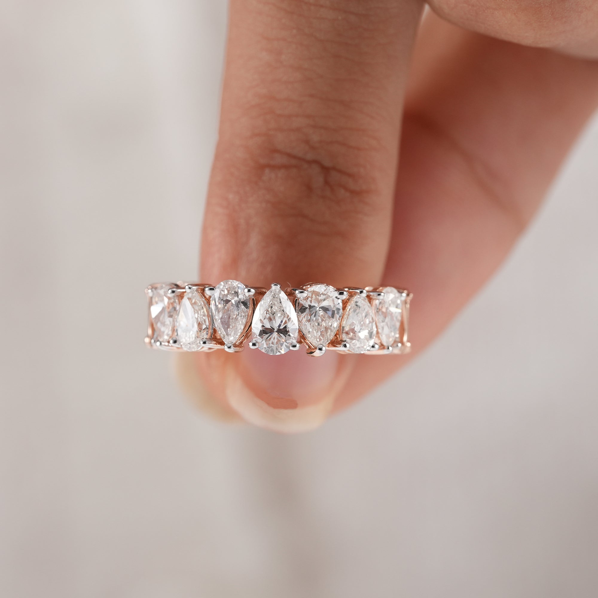 Full eternity lab diamond ring with pear cut diamonds.