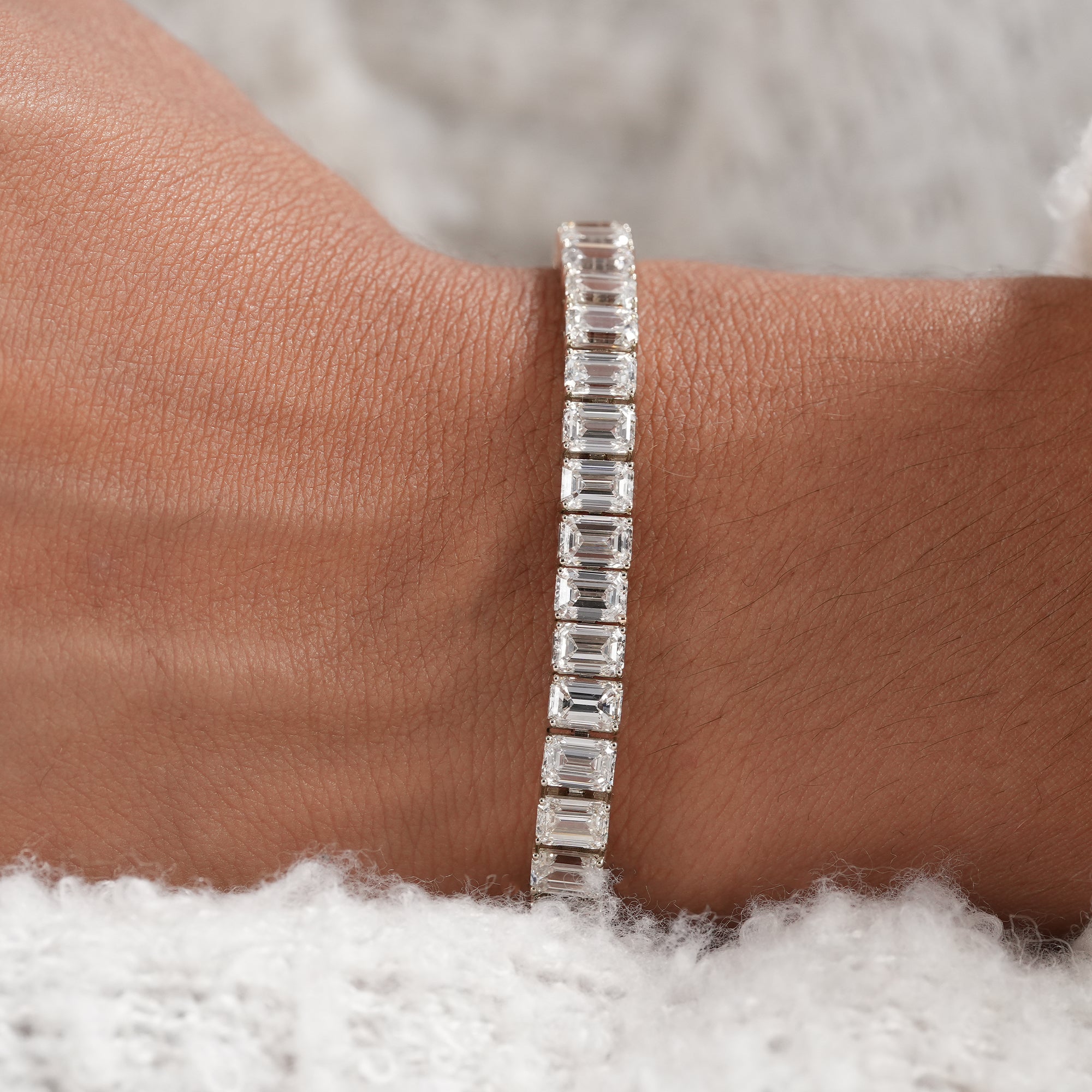 Women's emerald diamond bracelet for weddings and anniversaries.