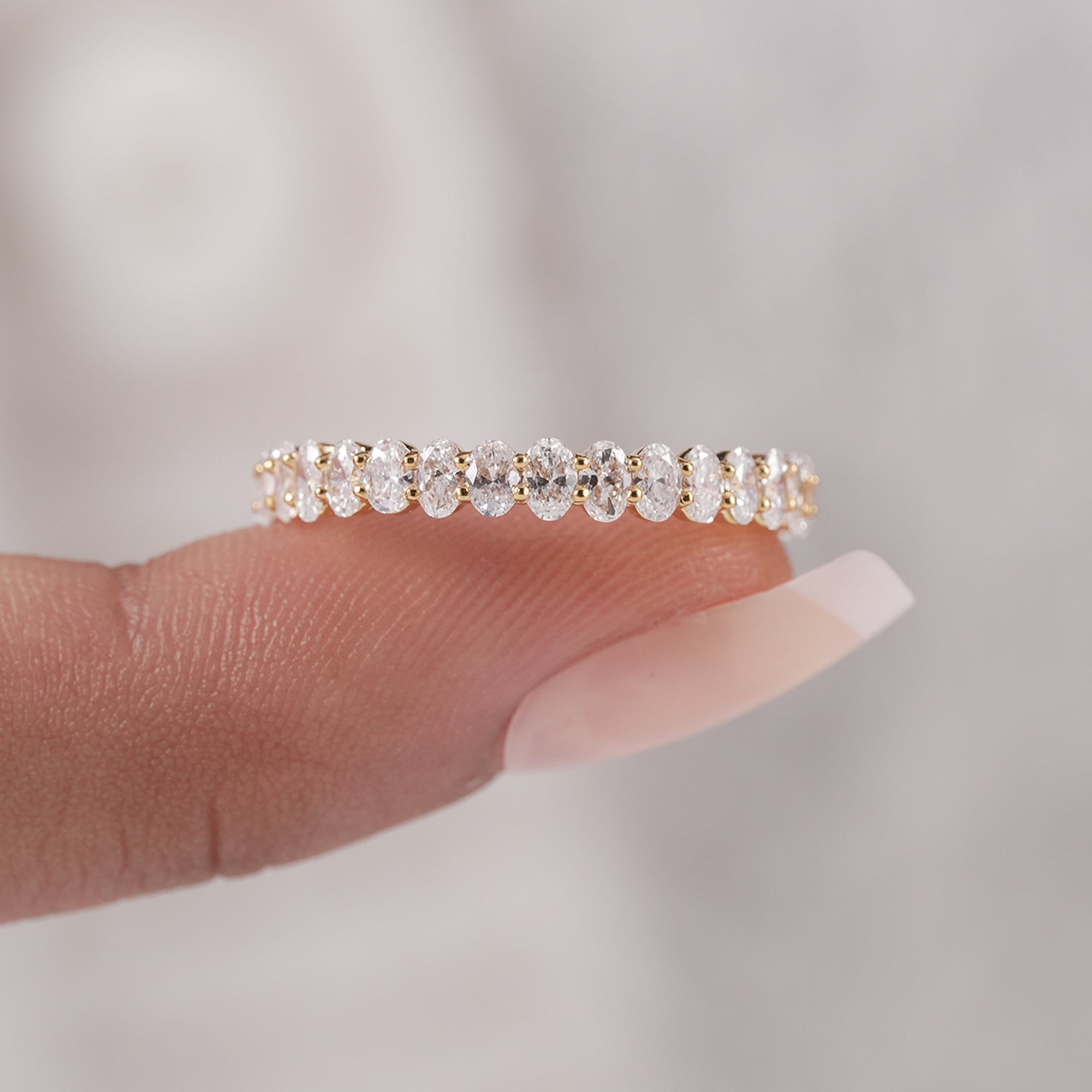 Sustainable oval cut diamond eternity ring.