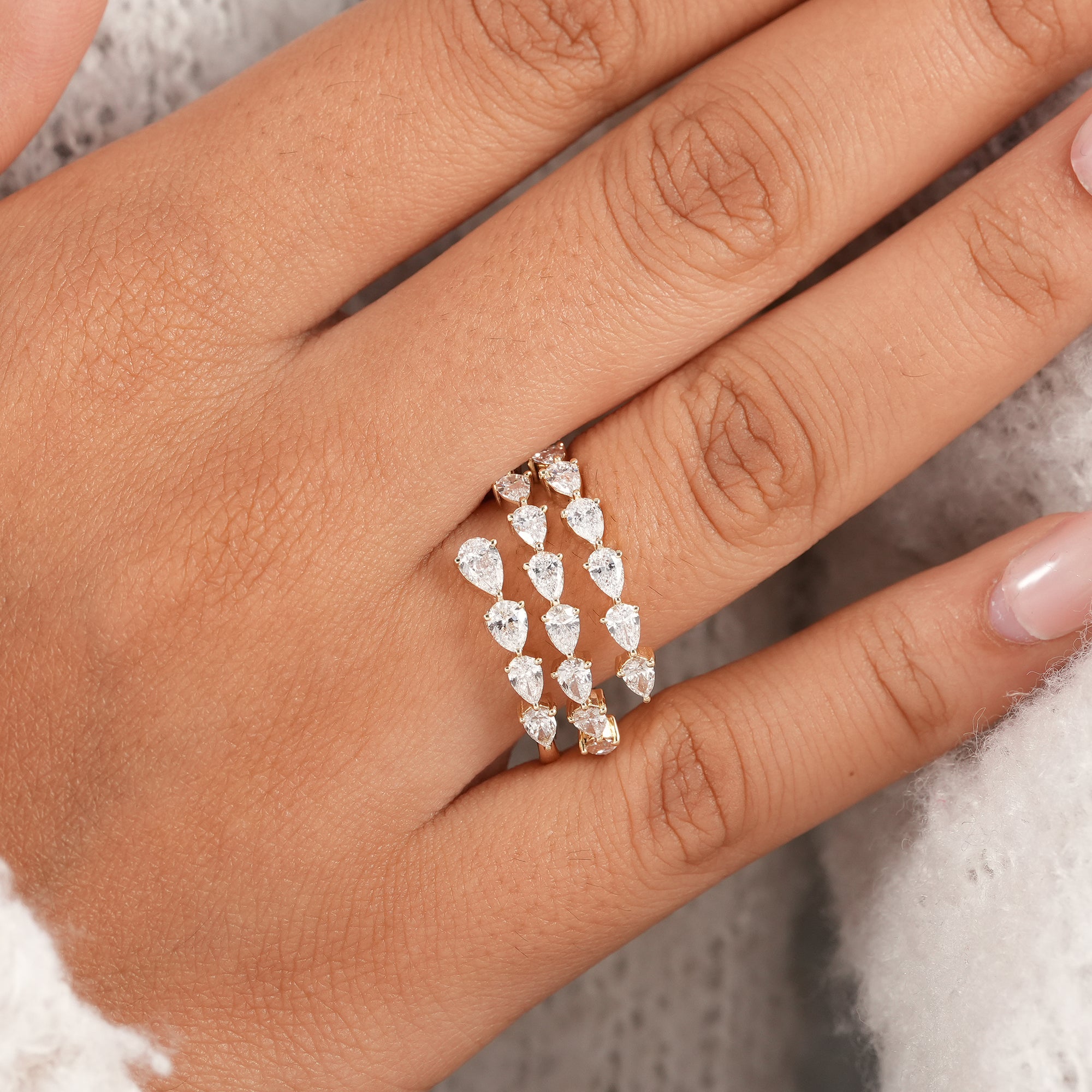 Triple row pear diamond anniversary ring.