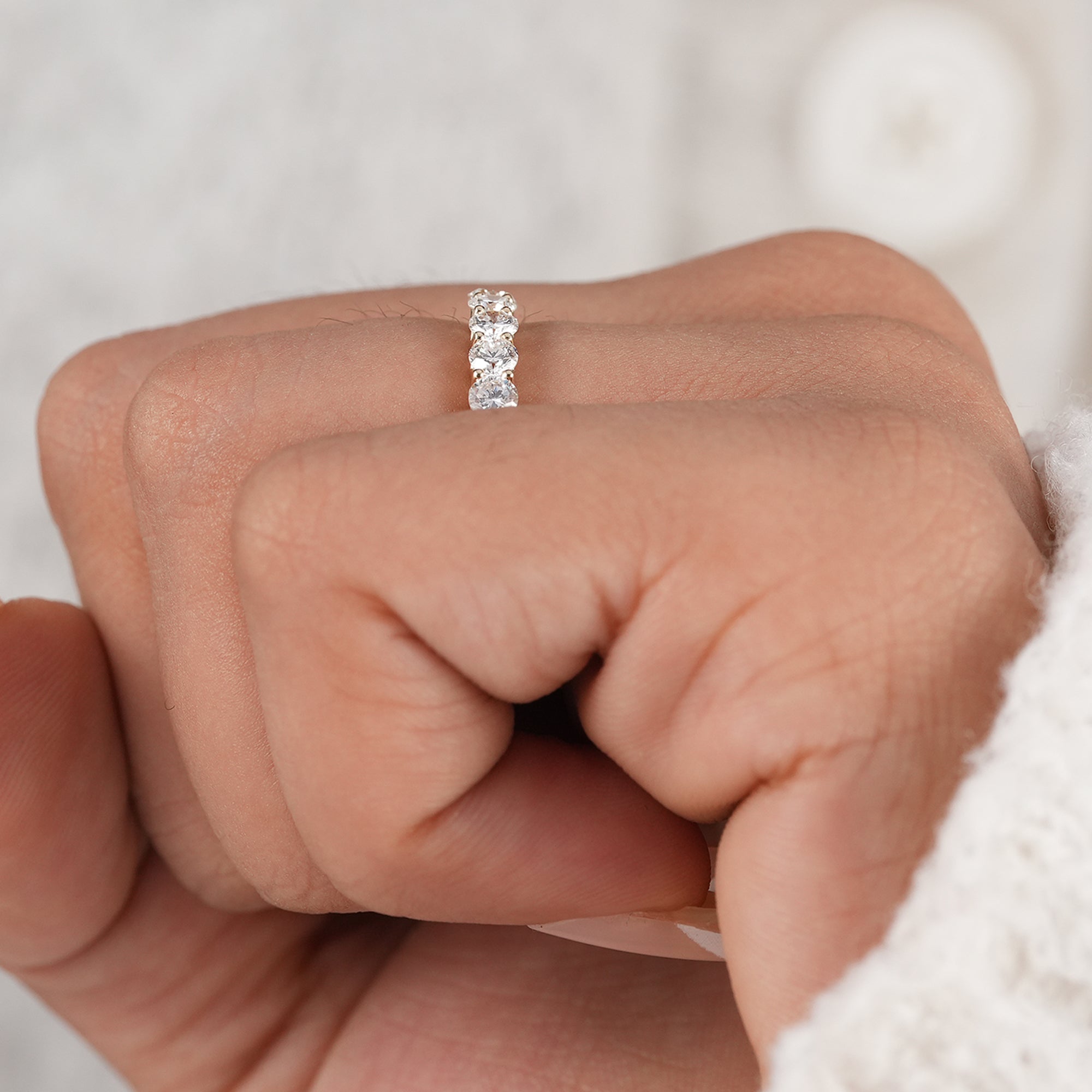 Modern minimalist round diamond wedding band.