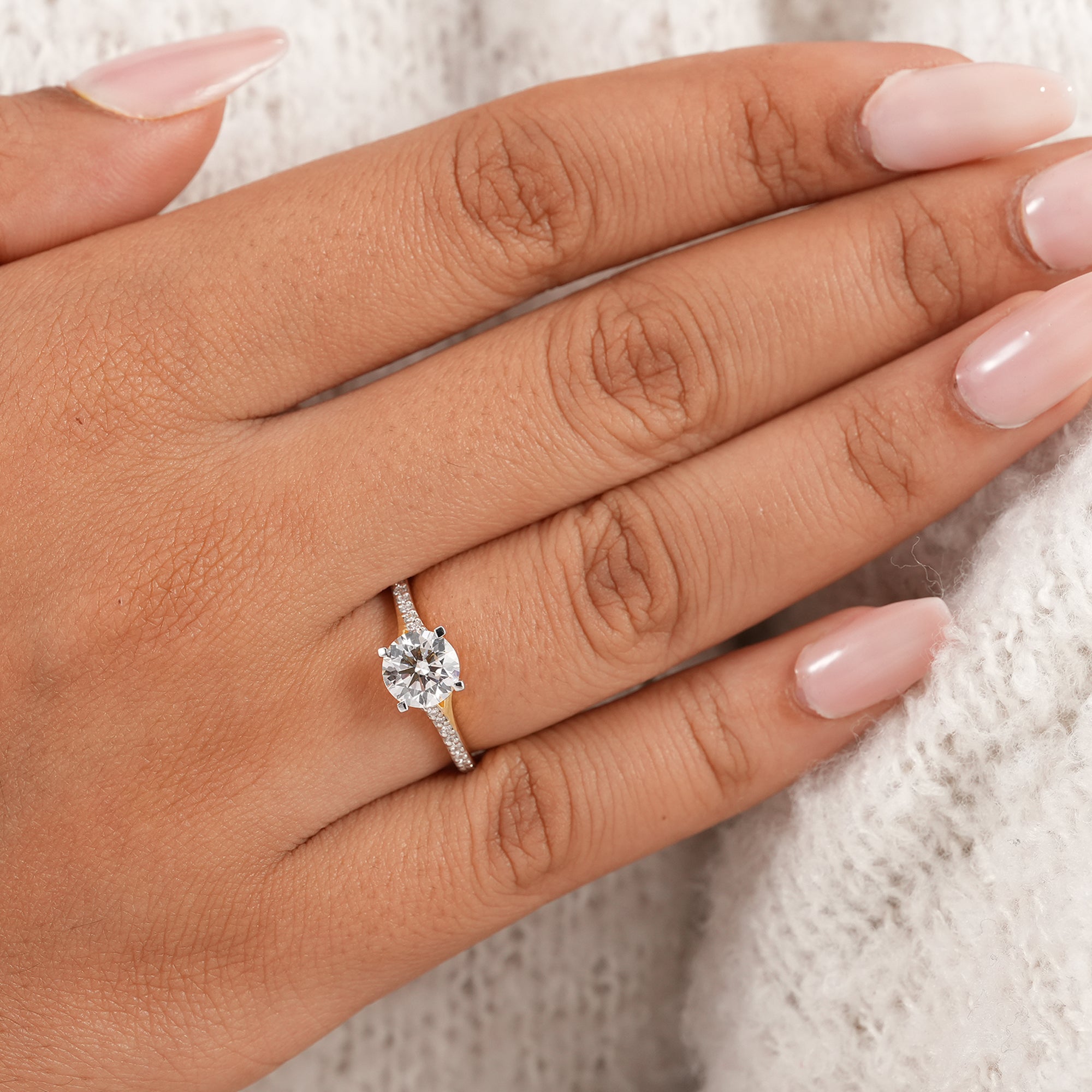 Elegant round diamond solitaire ring with split shank design