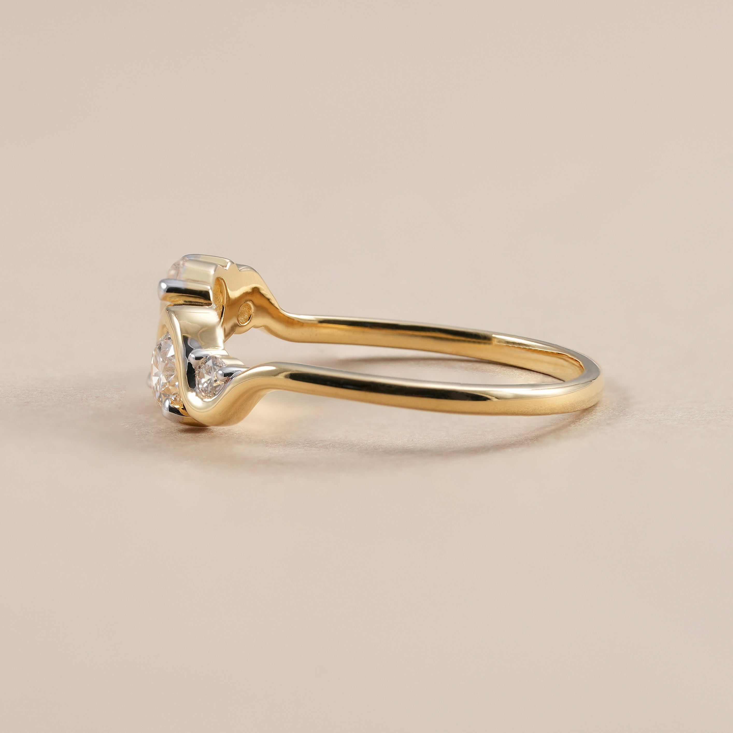 Modern round diamond wedding band for women in polished yellow gold.