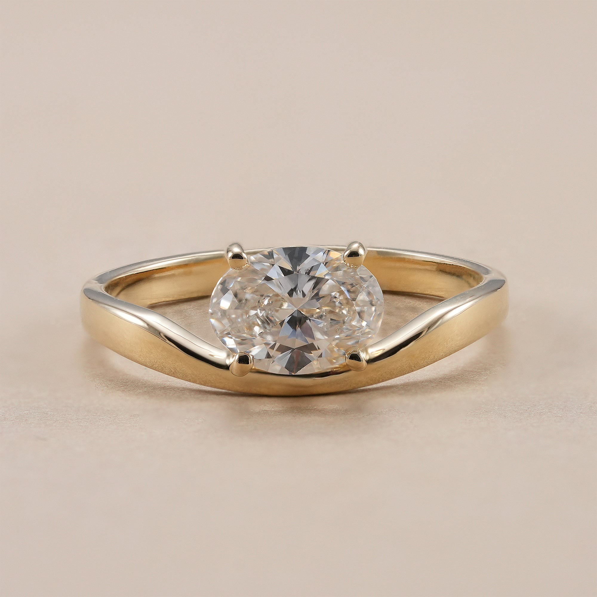 Chevron oval lab grown diamond engagement ring in yellow gold.