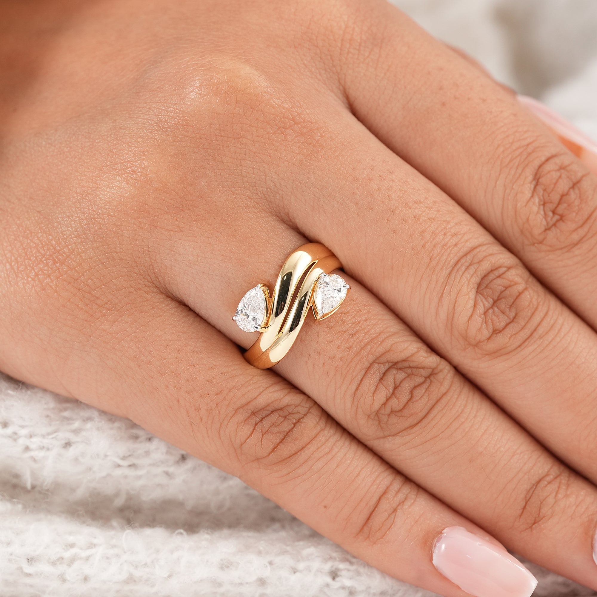 Pear toi et moi lab grown diamond ring with modern crossover gold band