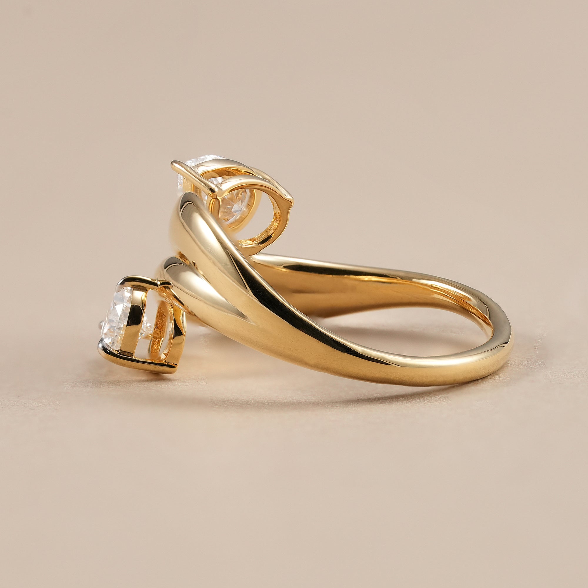 Contemporary pear lab diamond crossover ring for women in yellow gold