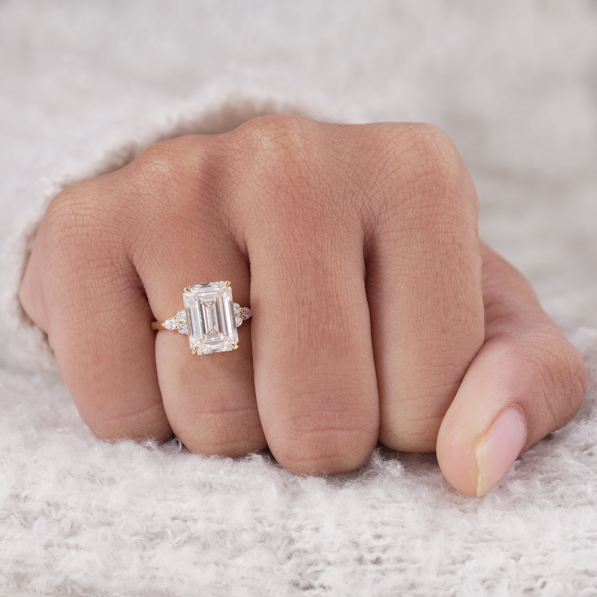 Elegant emerald engagement ring with pear accents