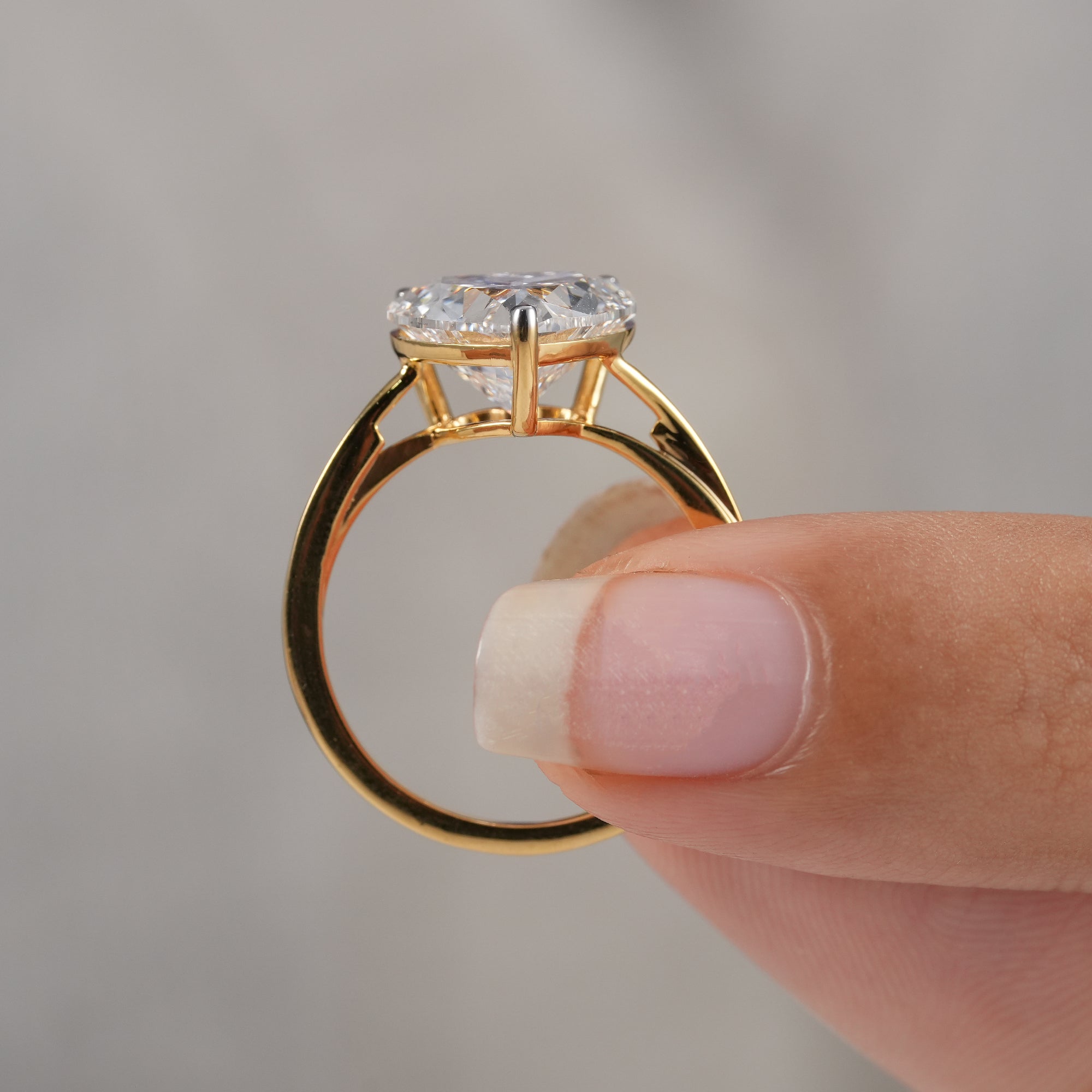 Classic heart cut engagement ring with secure prong setting.