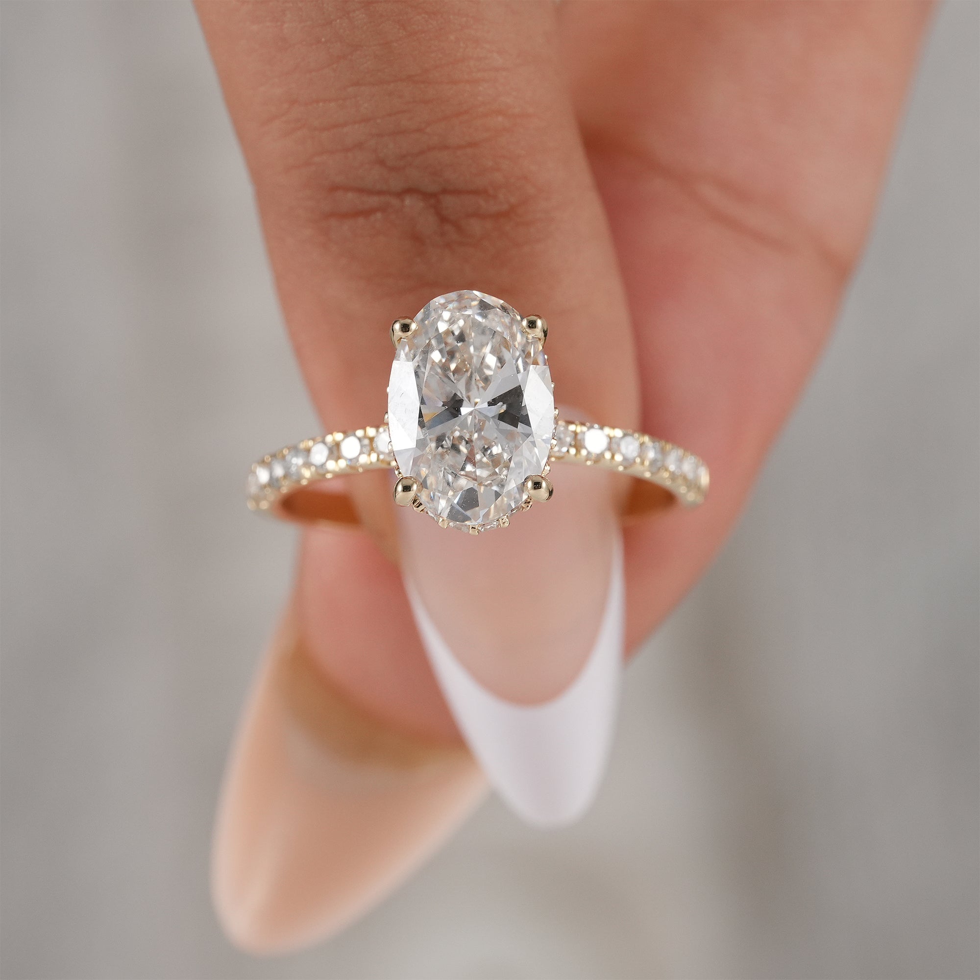 Minimalist oval lab grown diamond bridal ring.