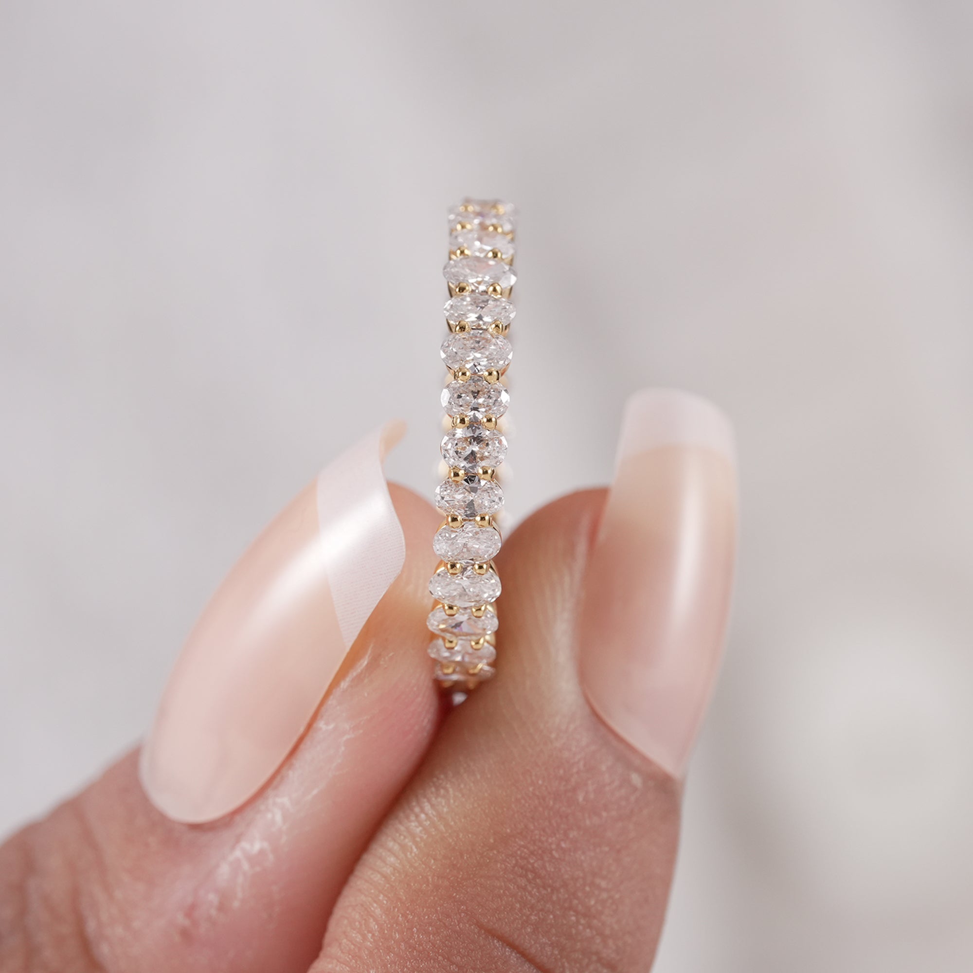 Handmade oval diamond eternity wedding ring.