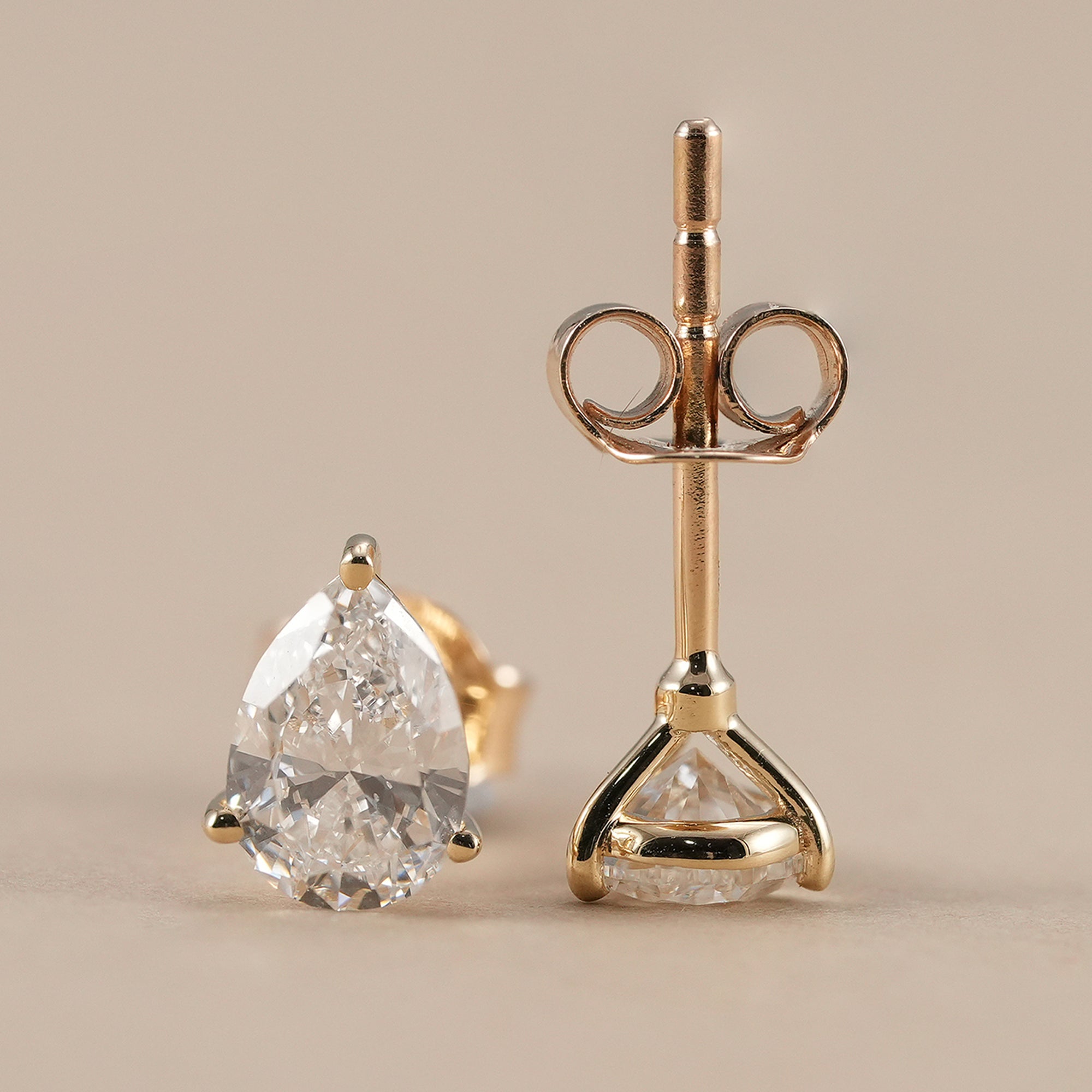 Elegant pear lab diamond stud earrings close-up