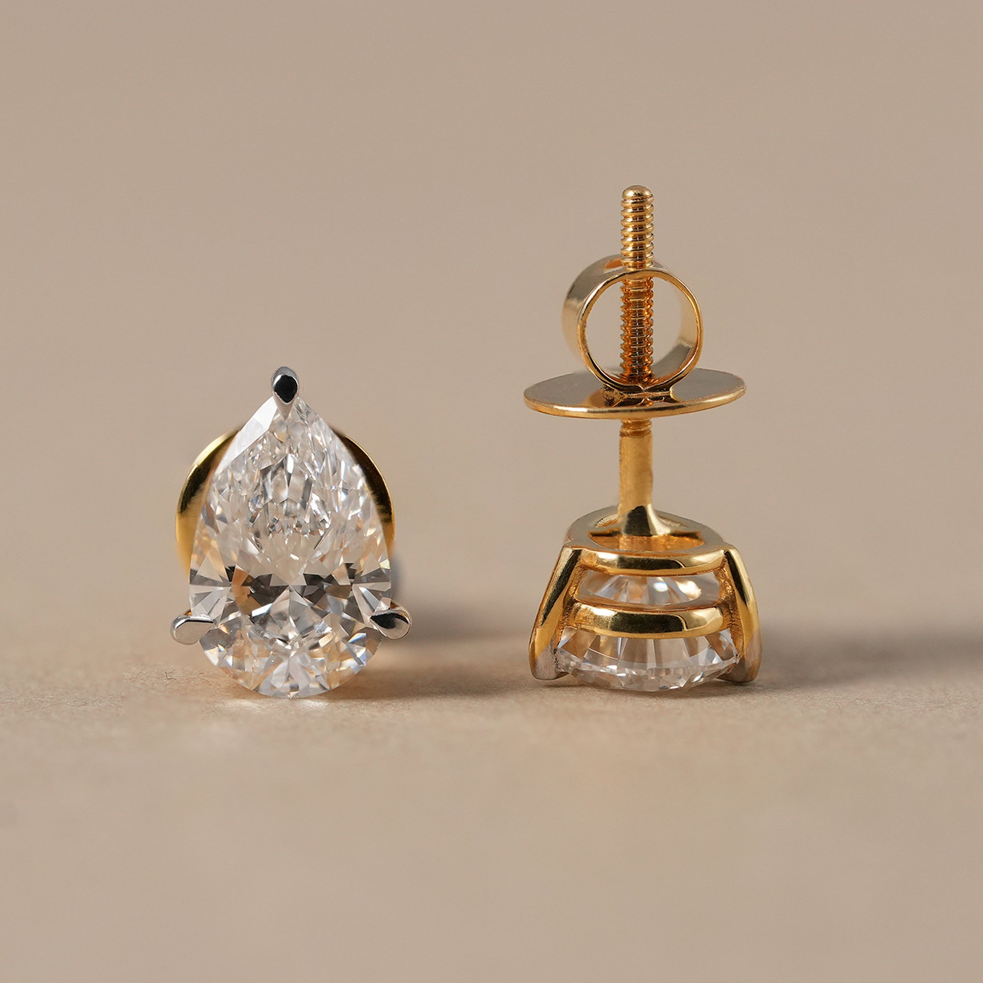 Minimalist pear diamond earrings with secure three prong setting