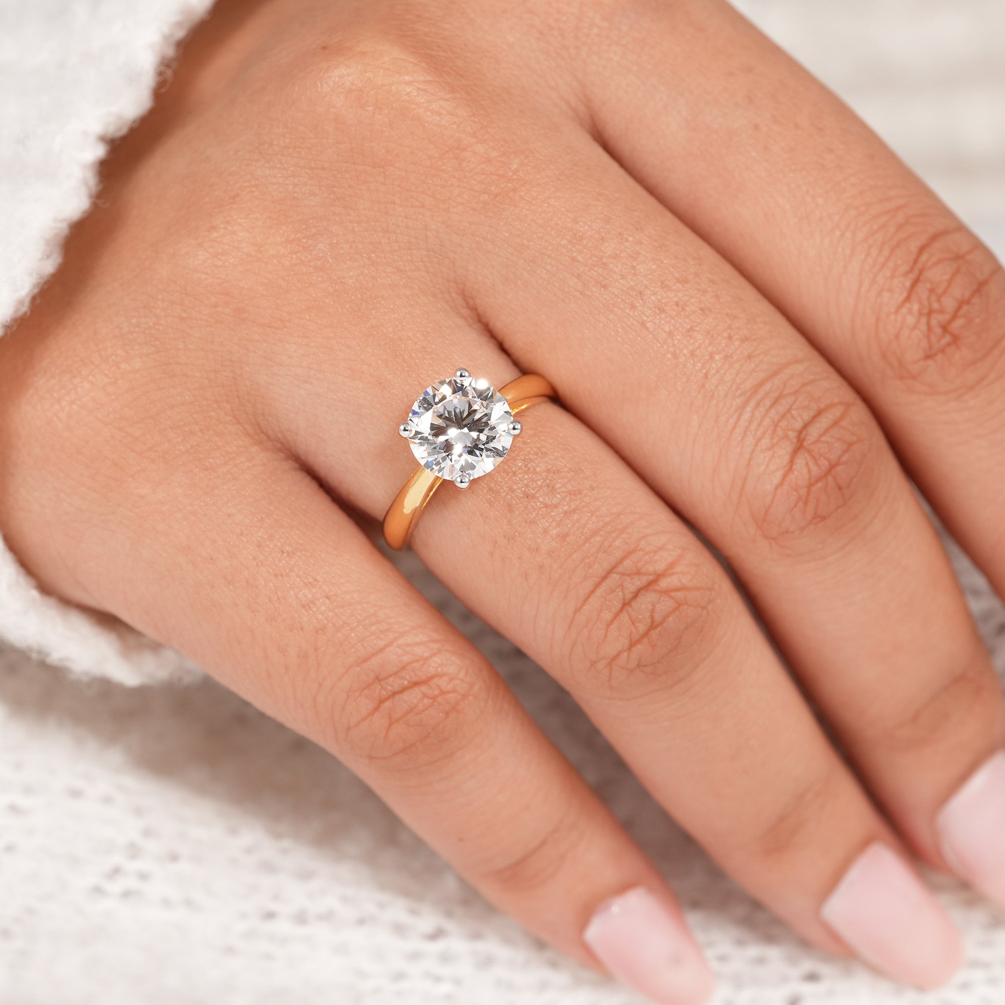 Round brilliant lab diamond engagement ring with cathedral mount