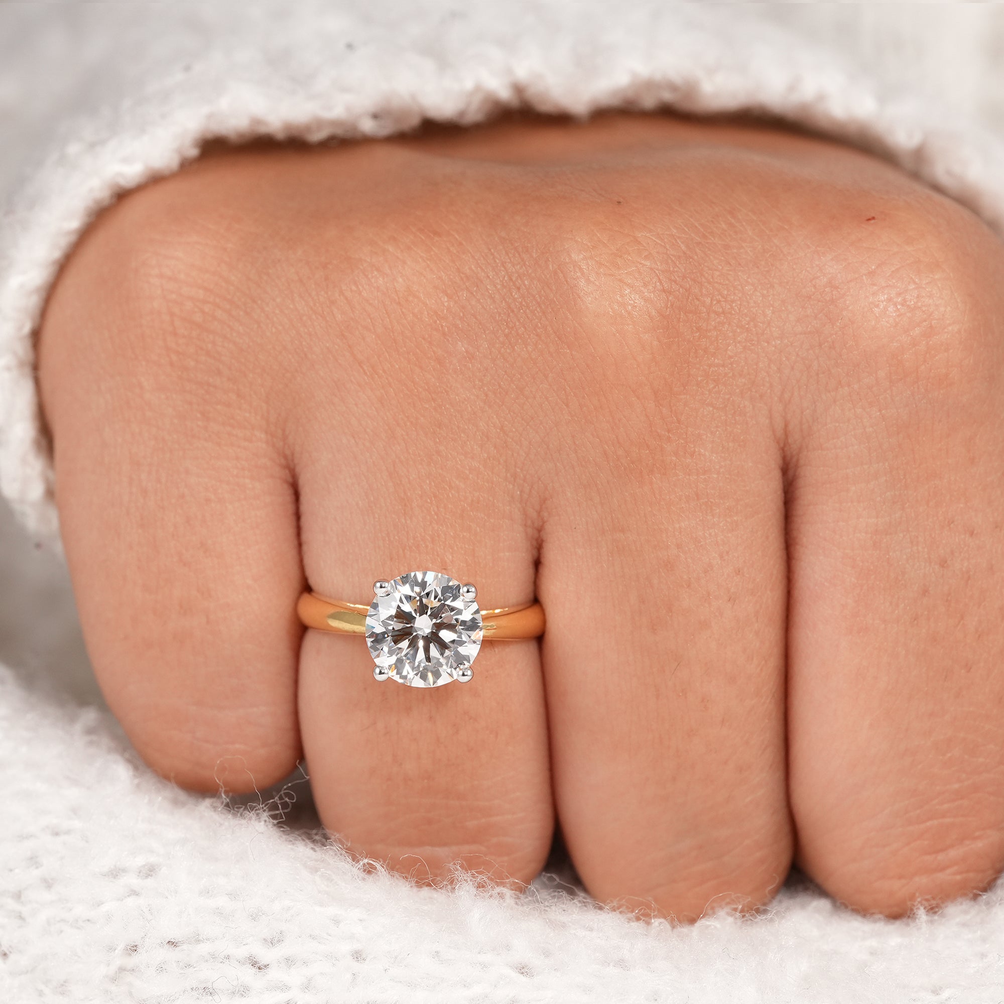 round diamond ring with secure four prong setting