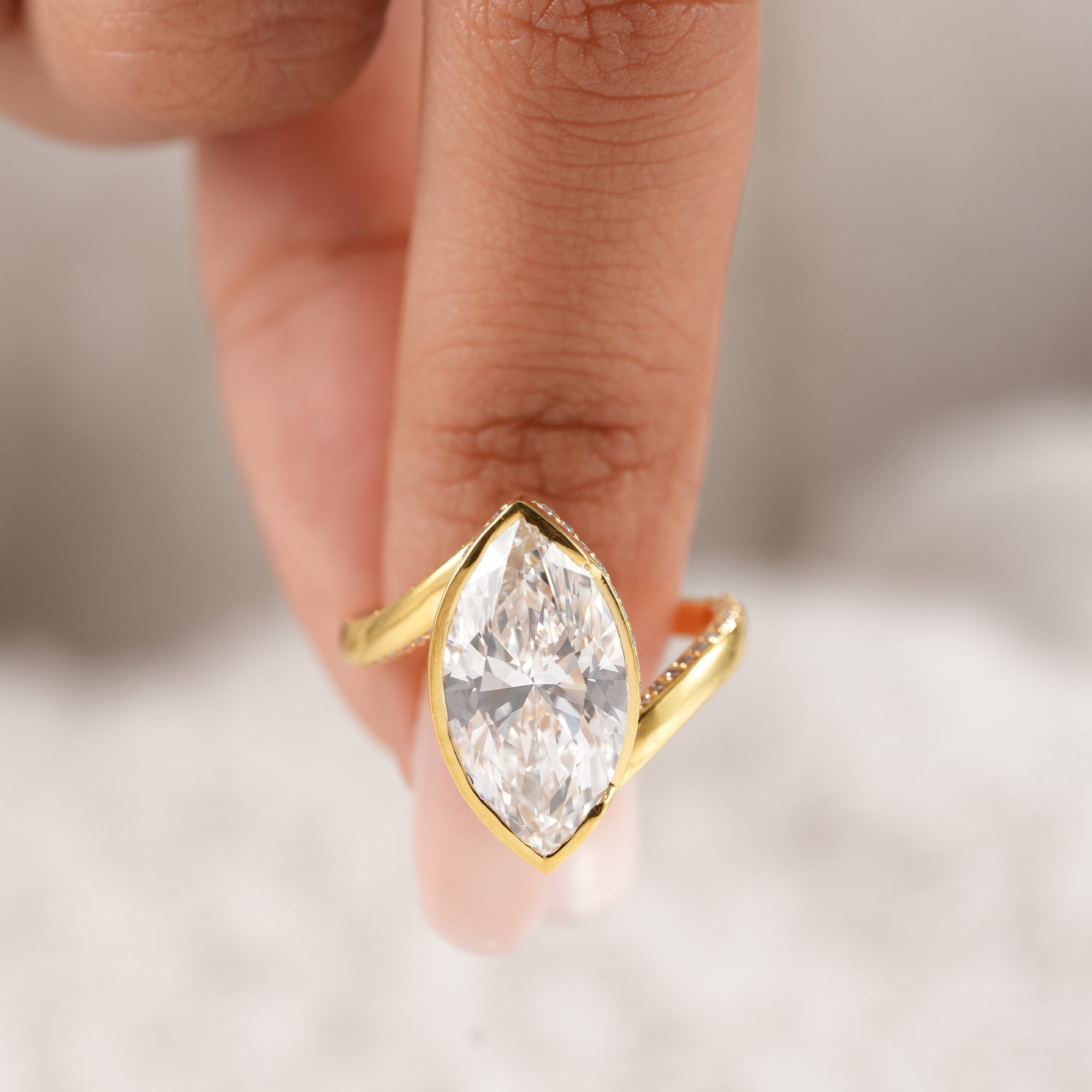 Sustainable lab grown marquise diamond engagement ring.