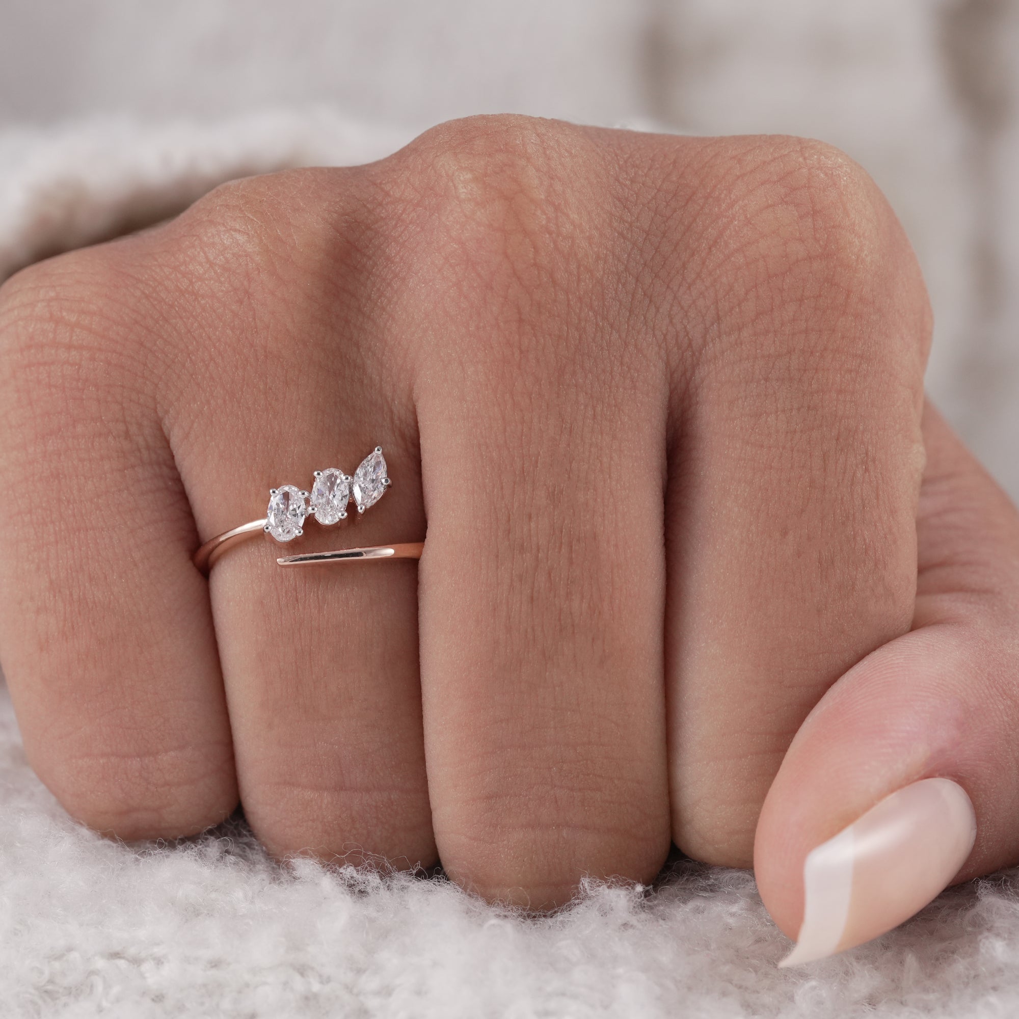 Delicate bridal ring featuring oval and marquise diamonds