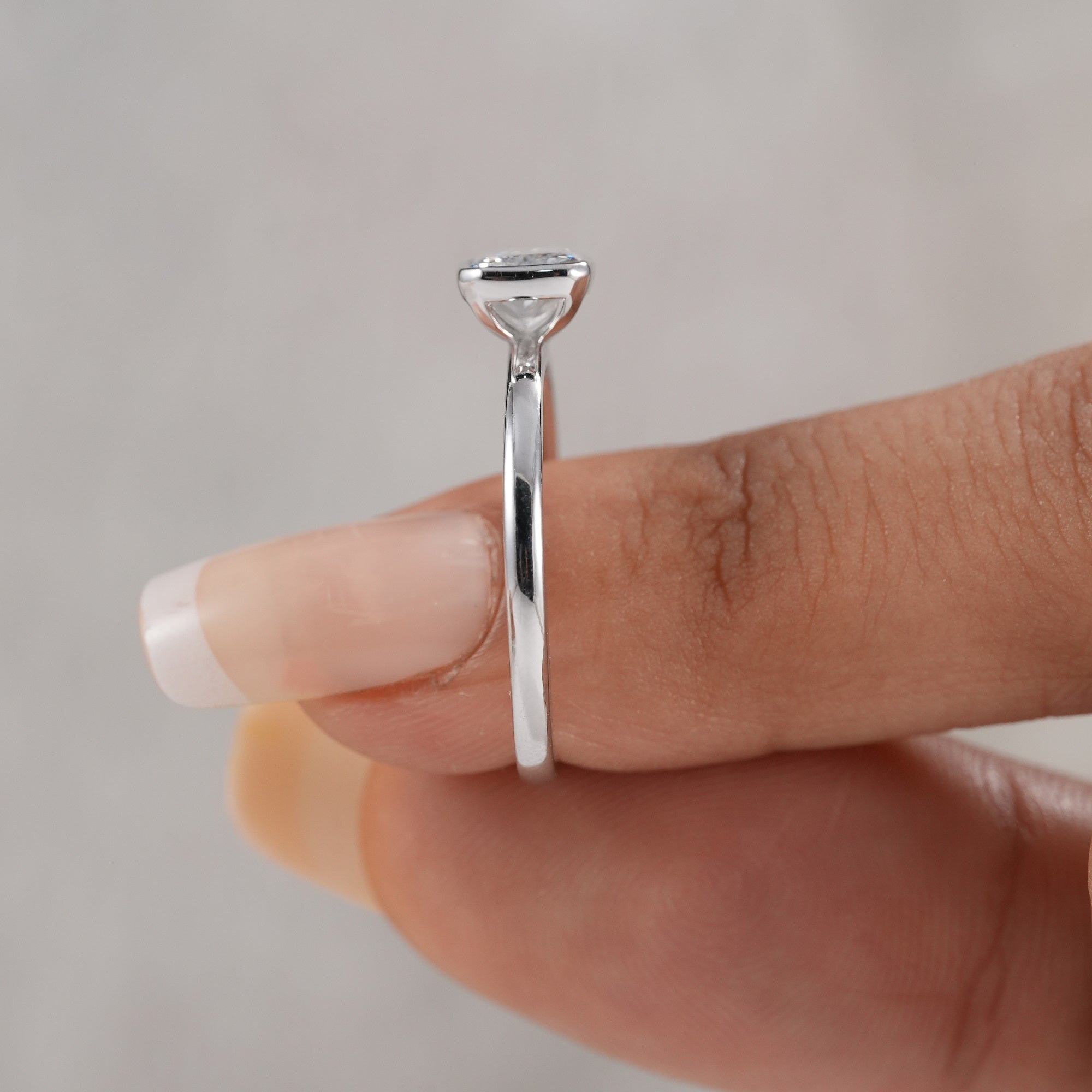 East west radiant cut diamond ring with modern minimalist design