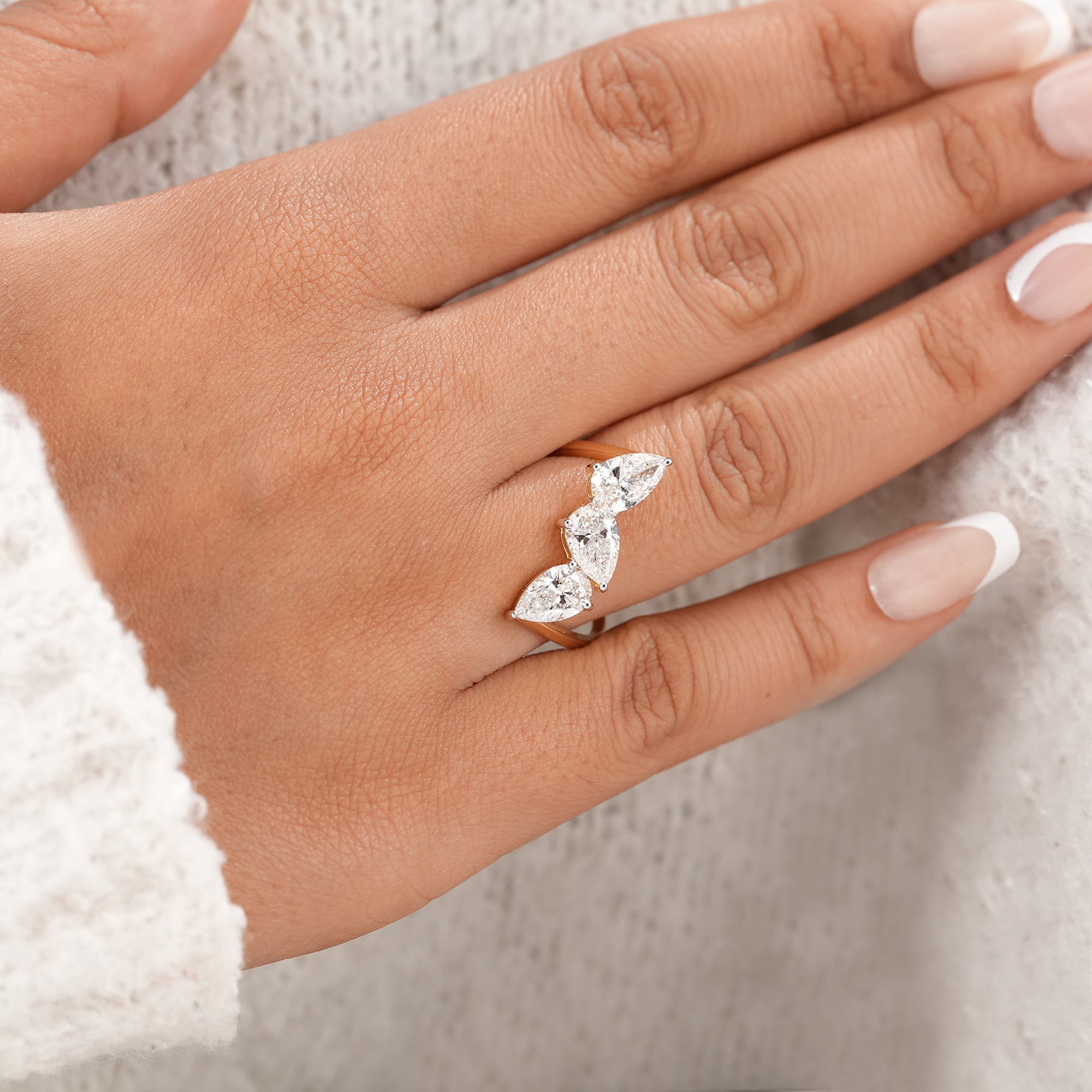 Minimalist three stone pear diamond ring