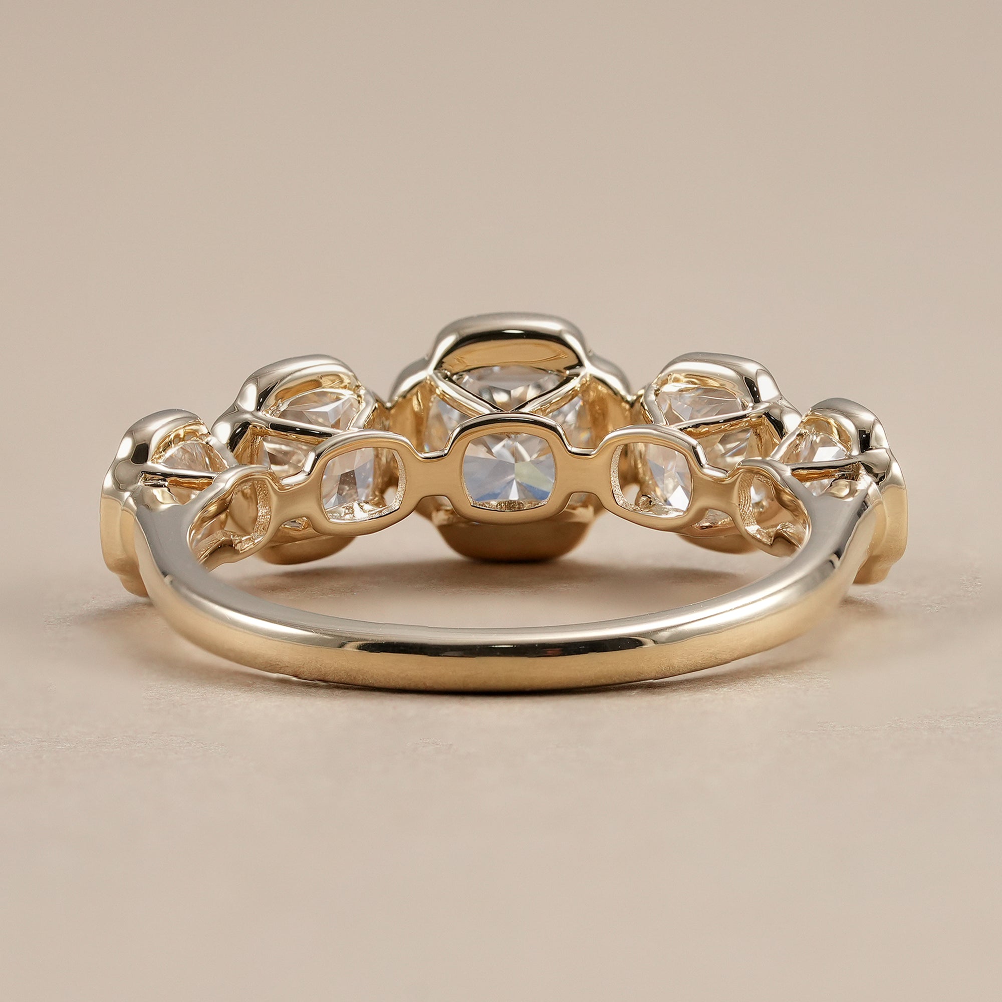 Lab grown diamond wedding band featuring five cushion cut diamonds.