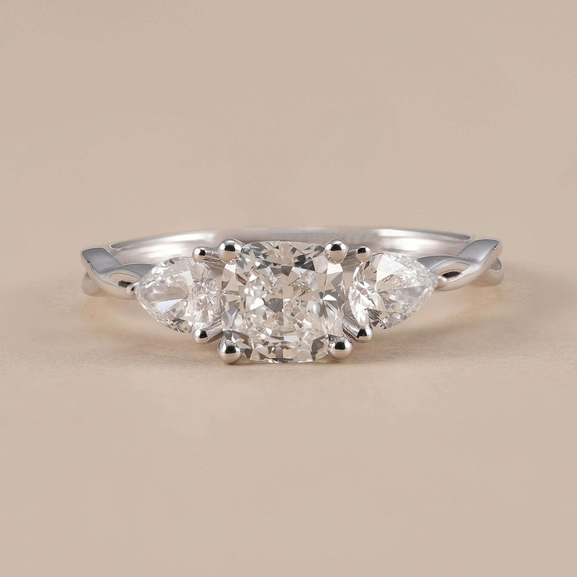 Cushion cut lab grown diamond three stone engagement ring