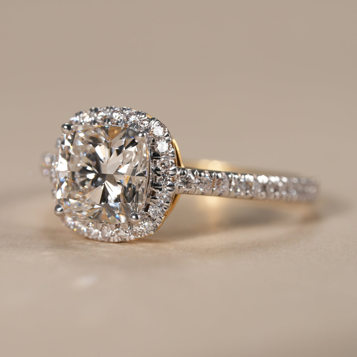IGI certified cushion cut diamond halo ring handcrafted with brilliant lab grown diamonds.