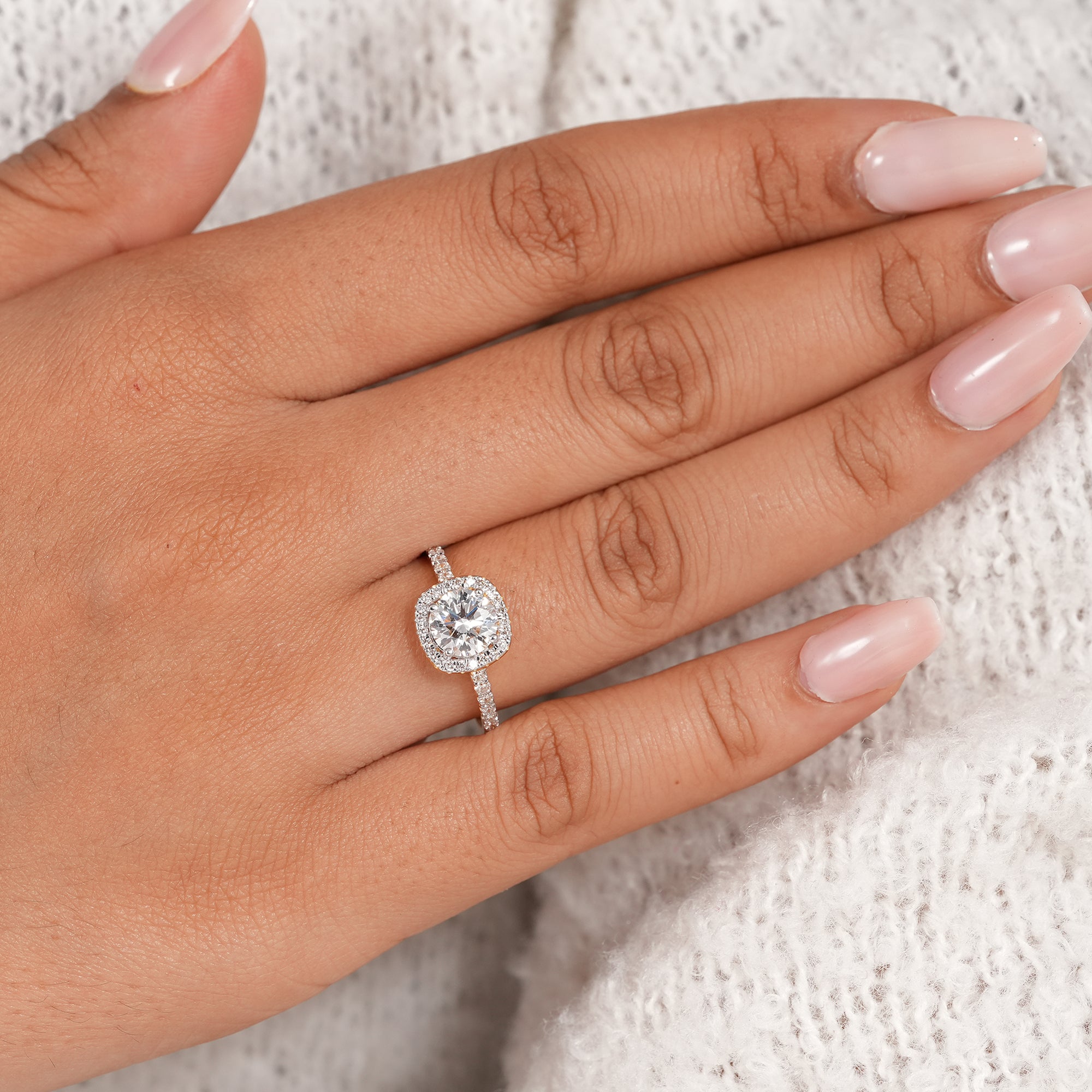 Elegant round diamond halo ring with pavé setting