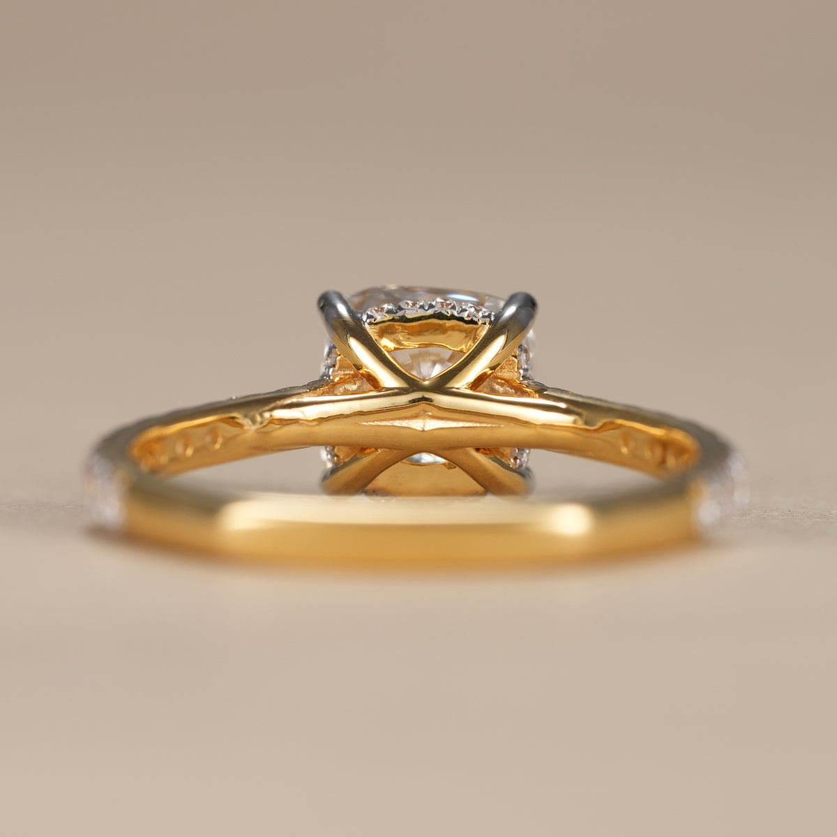Luxury cushion diamond ring showcasing a hidden halo beneath a sparkling cushion-cut center stone.