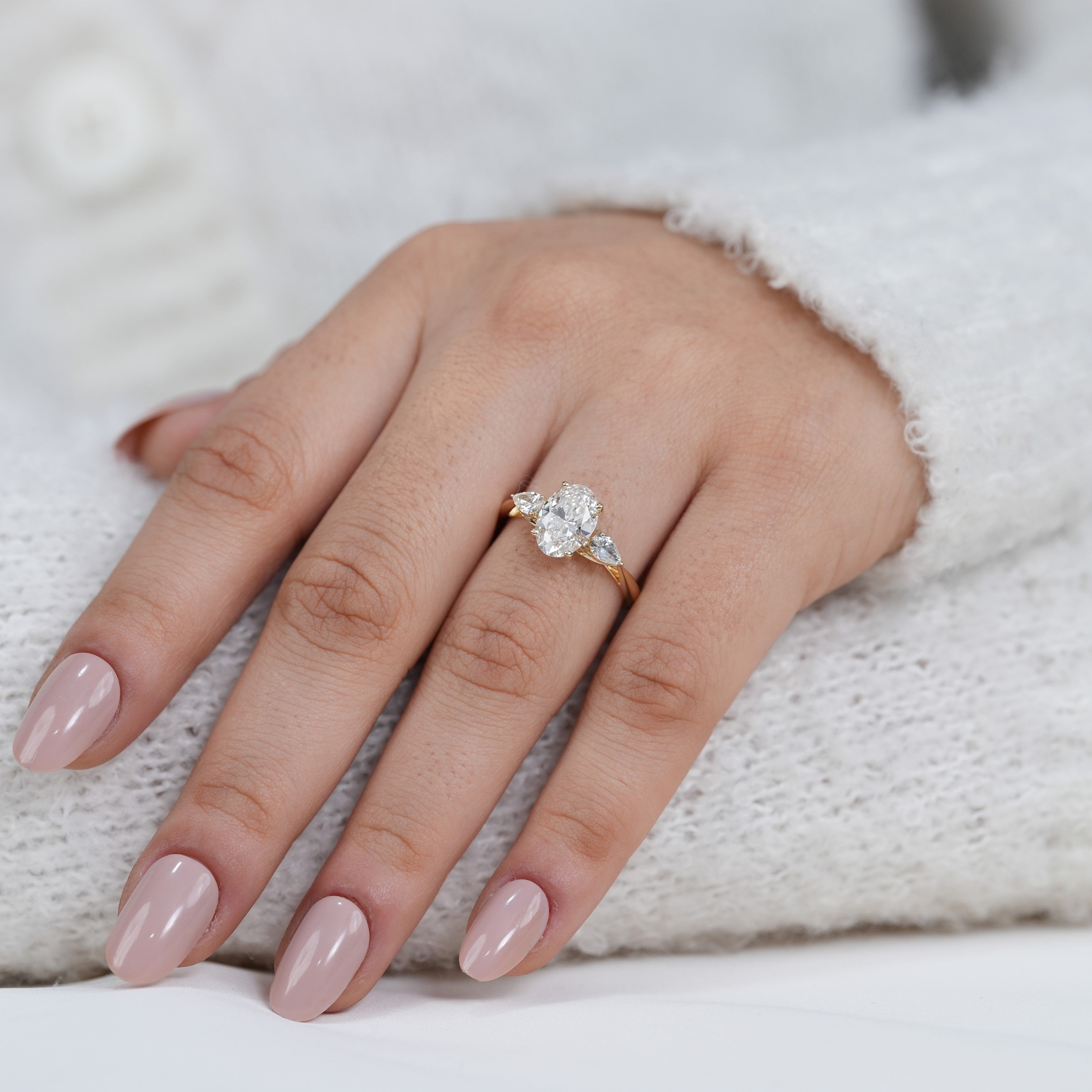 Oval lab grown diamond ring with pear sides timeless design