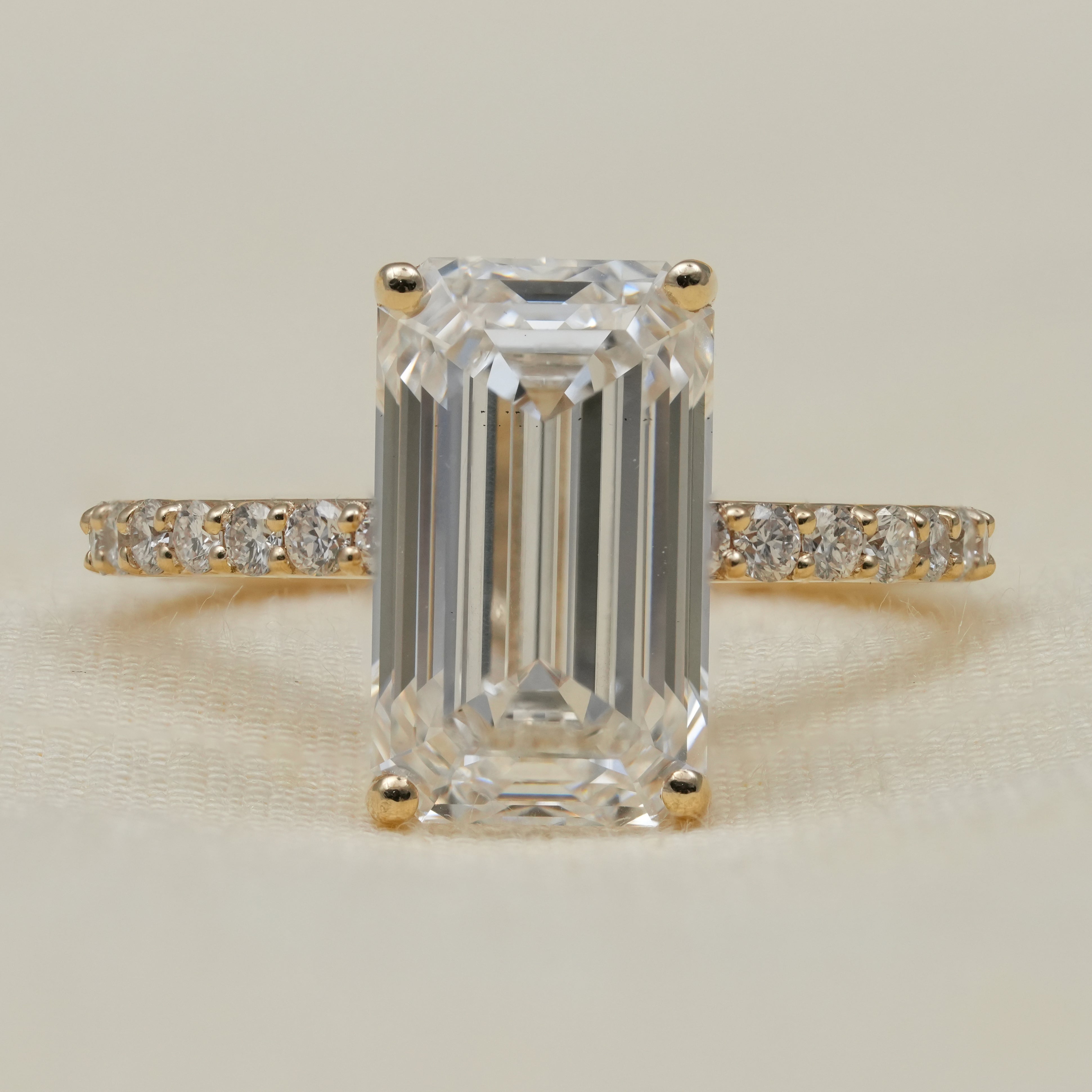 Emerald cut lab grown diamond ring with hidden halo for anniversary