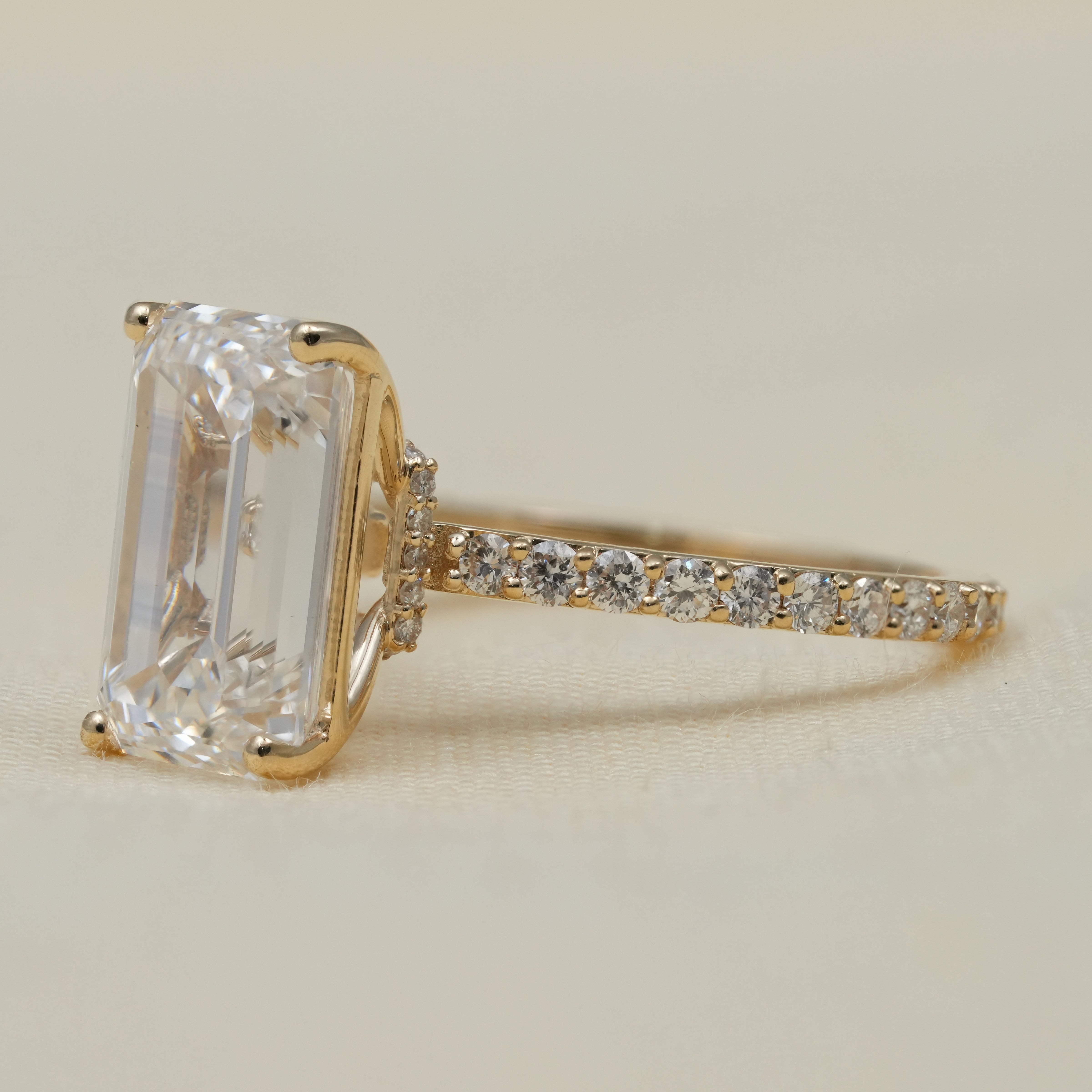 Lab grown diamond emerald cut ring with hidden halo elegance